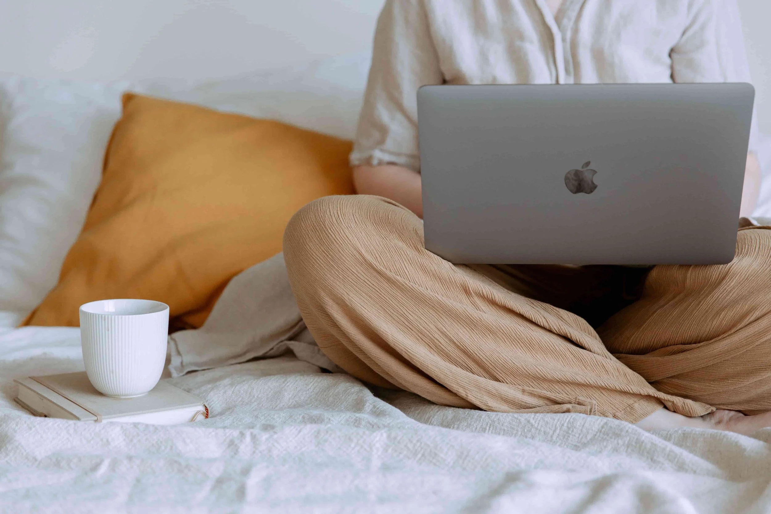 Is Online Therapy as Effective as In-Person Sessions?- woman on laptop with coffee mug
