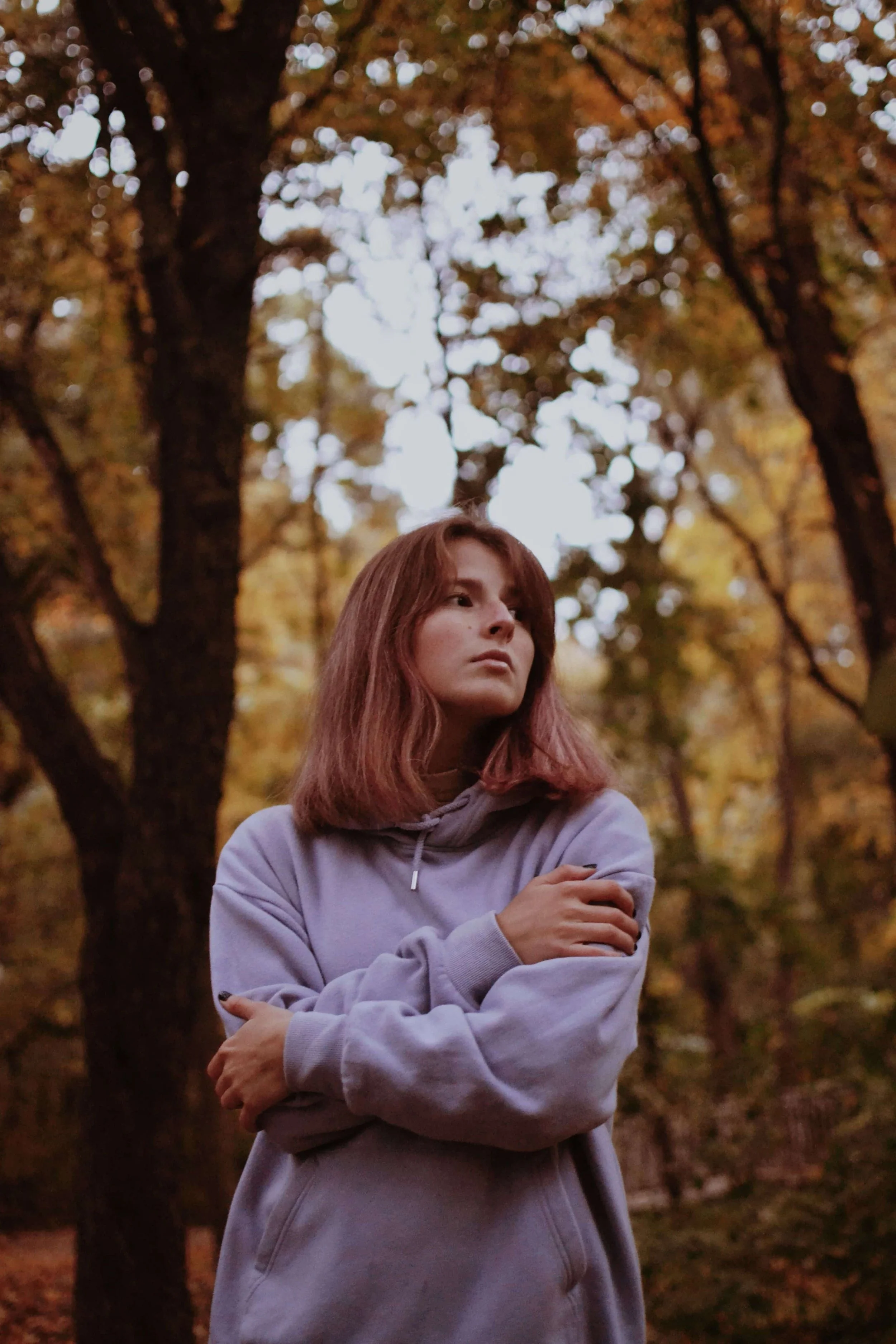 When EMDR Is Often Recommended in Trauma Treatment- Women with trees in the background looking into the distance
