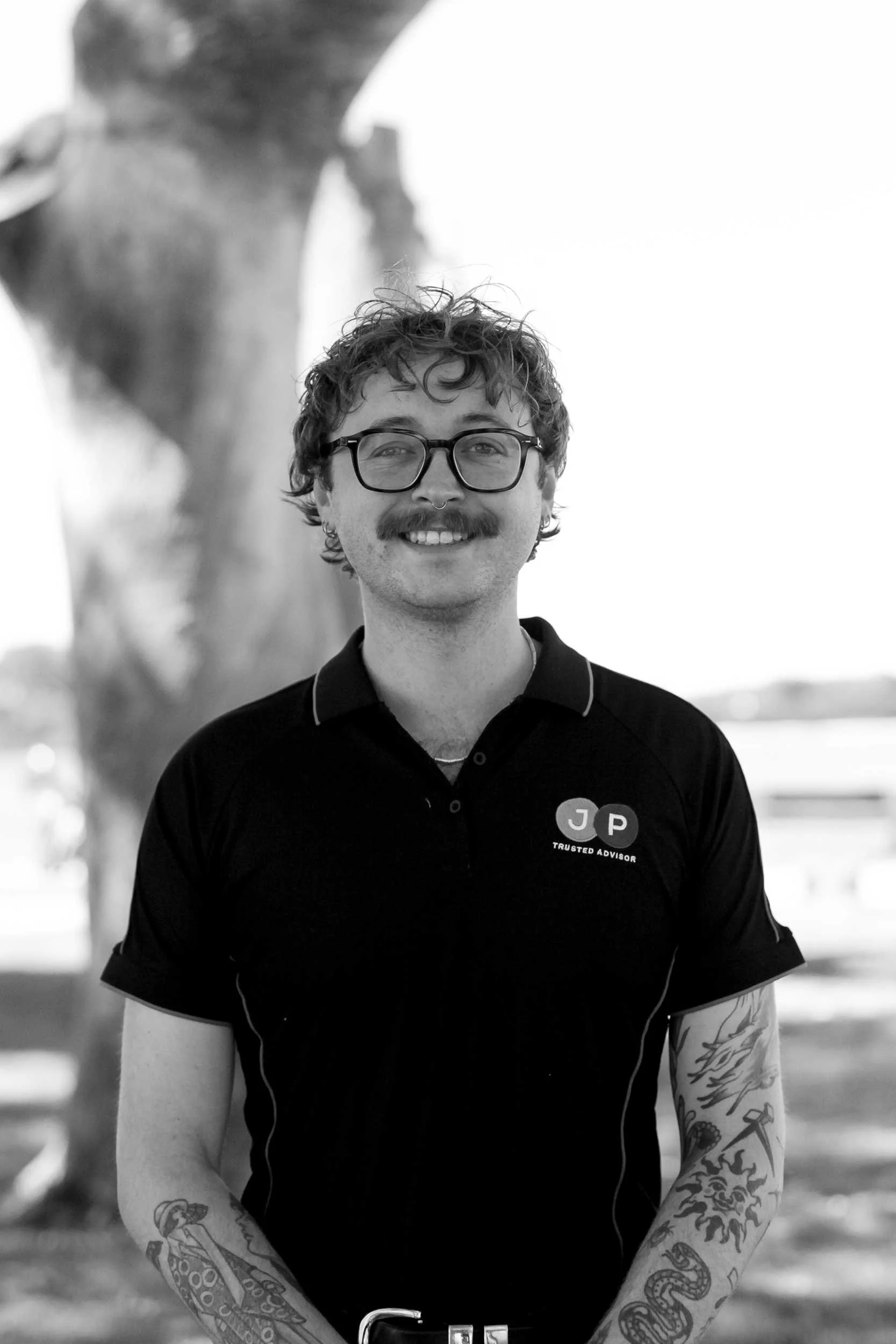 A photograph of Kaleb Norman, a Specialist Support Coordinator at JP Trusted Advisor