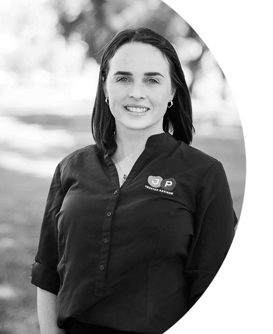 A professional black and white photograph of Shelby Theunissen, Assistant Support Coordinator at JP Trusted Advisor