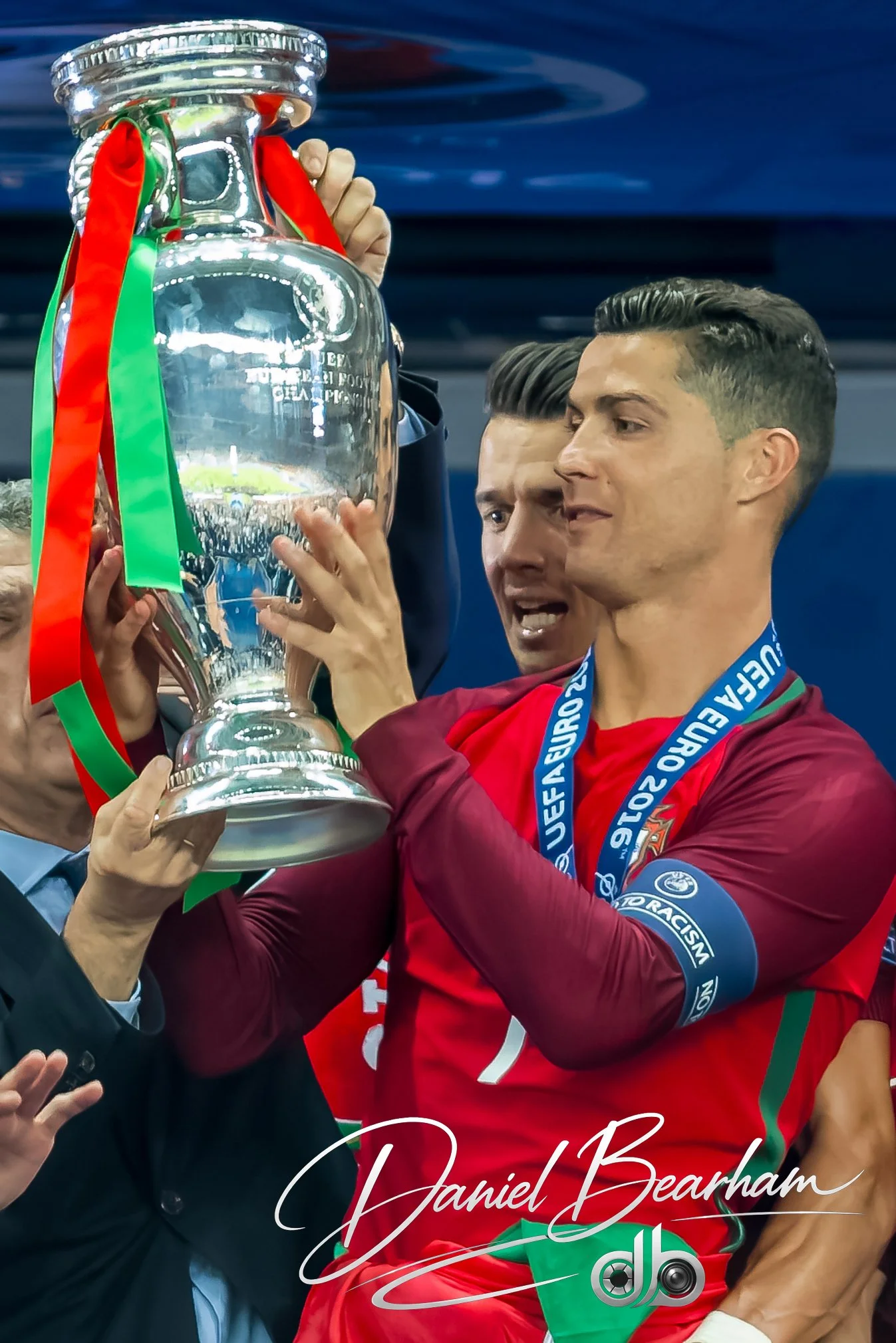 Cristiano Ronaldo gazes at the Euro 2016 Trophy Won By his Portugal Team