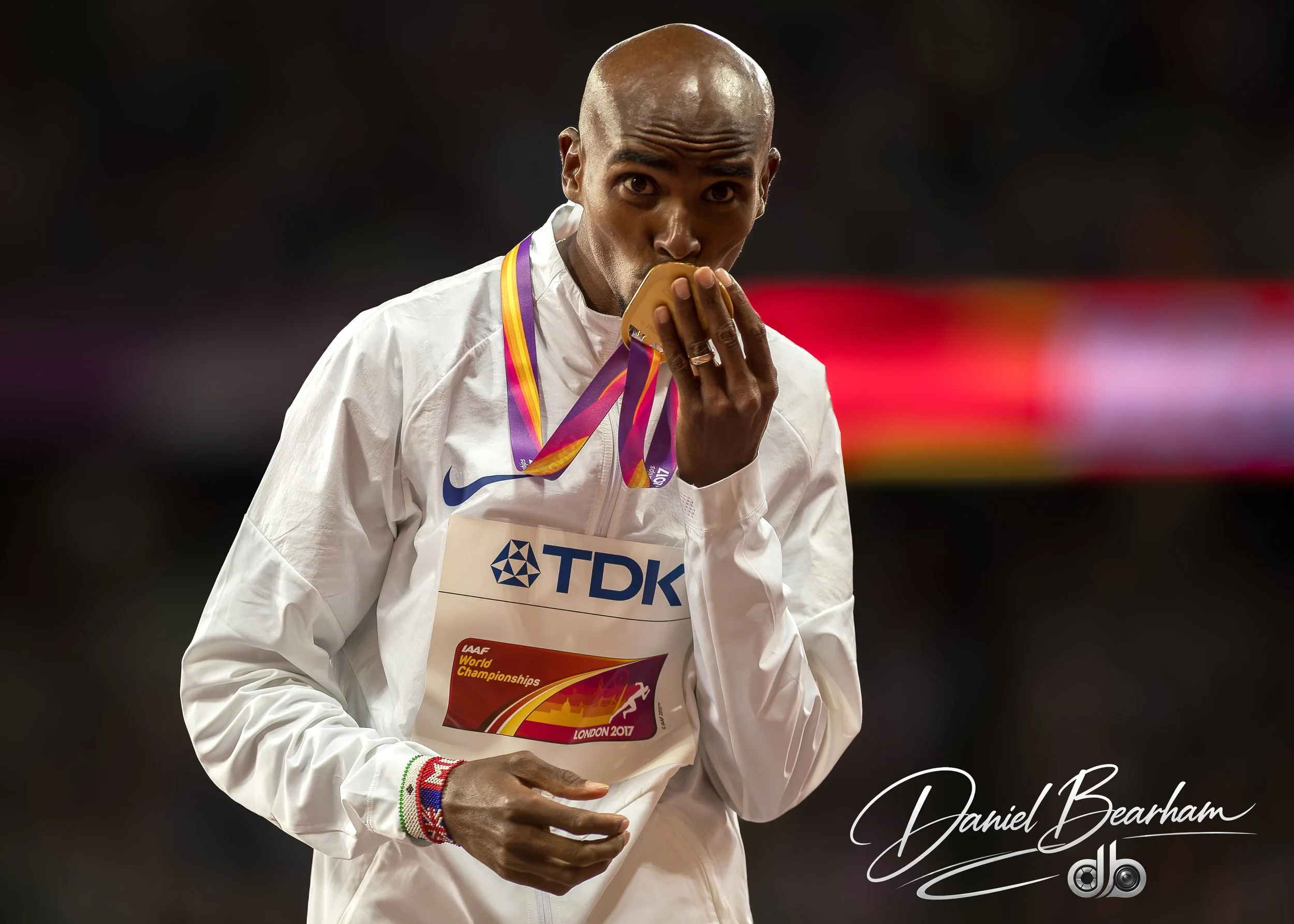 Sir Mo Farah kisses his Worls Champion Gold Medal