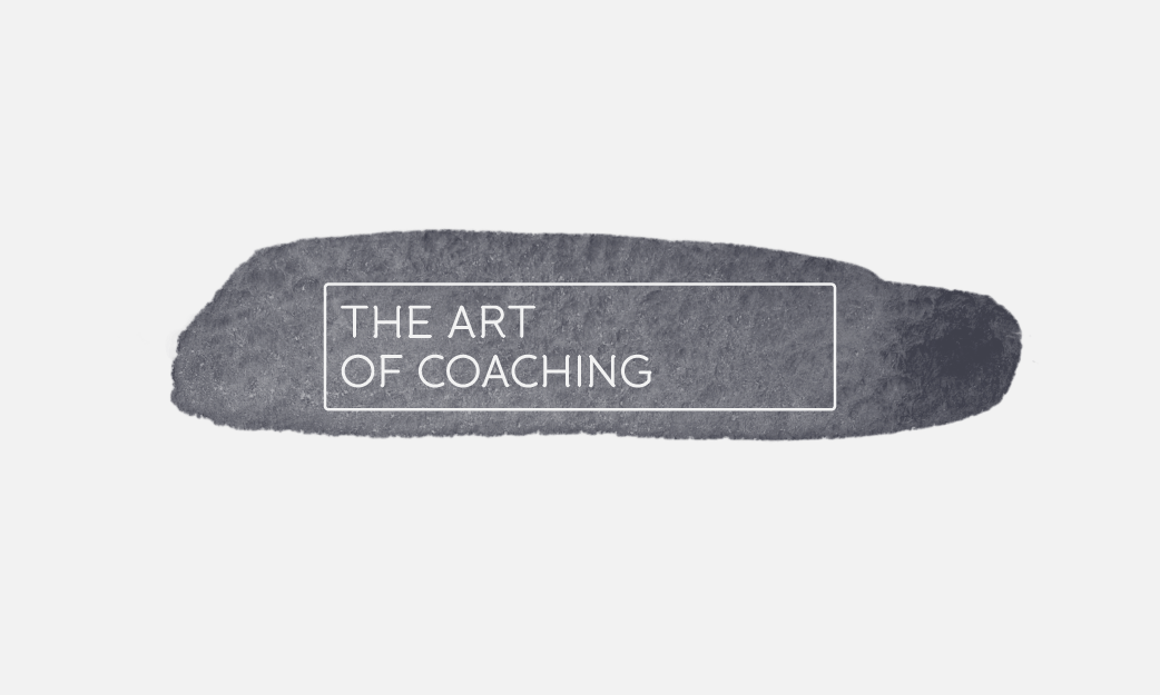 The Logo for 'The Art of Coaching' – which features the whiteout sans-serif font from a water colour brush-stroke background