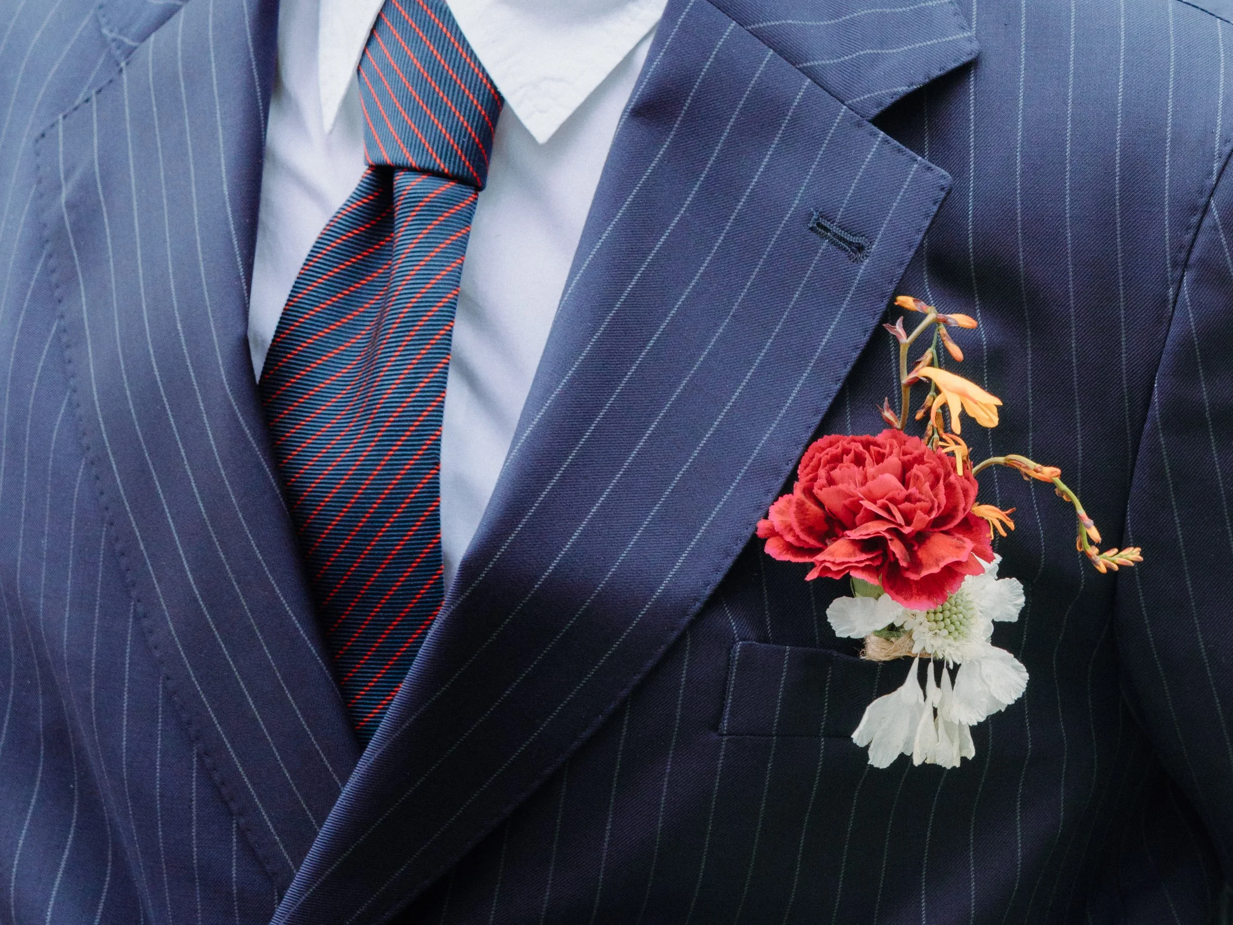 H&J - Couples Shoot - Jacks flower pin .jpg