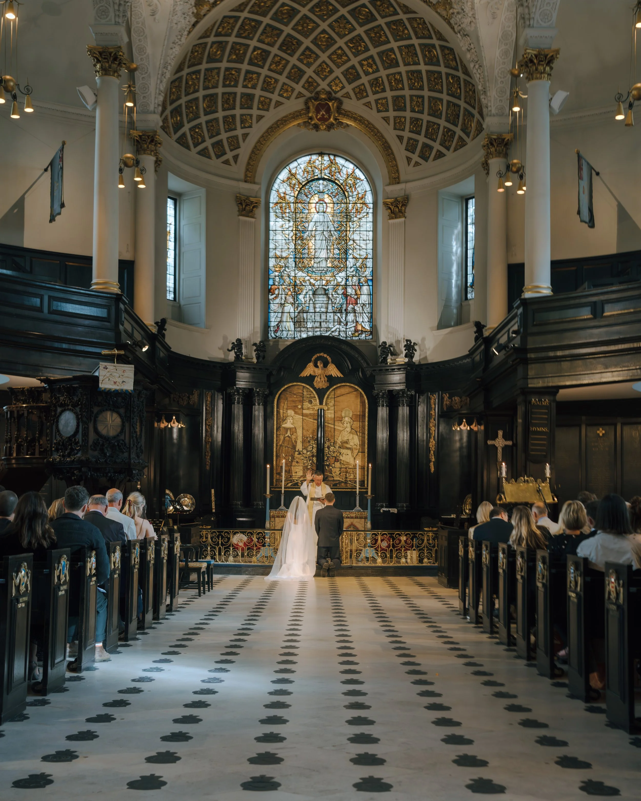 H&J - Ceremony - Knelt down in front of the altar .jpg