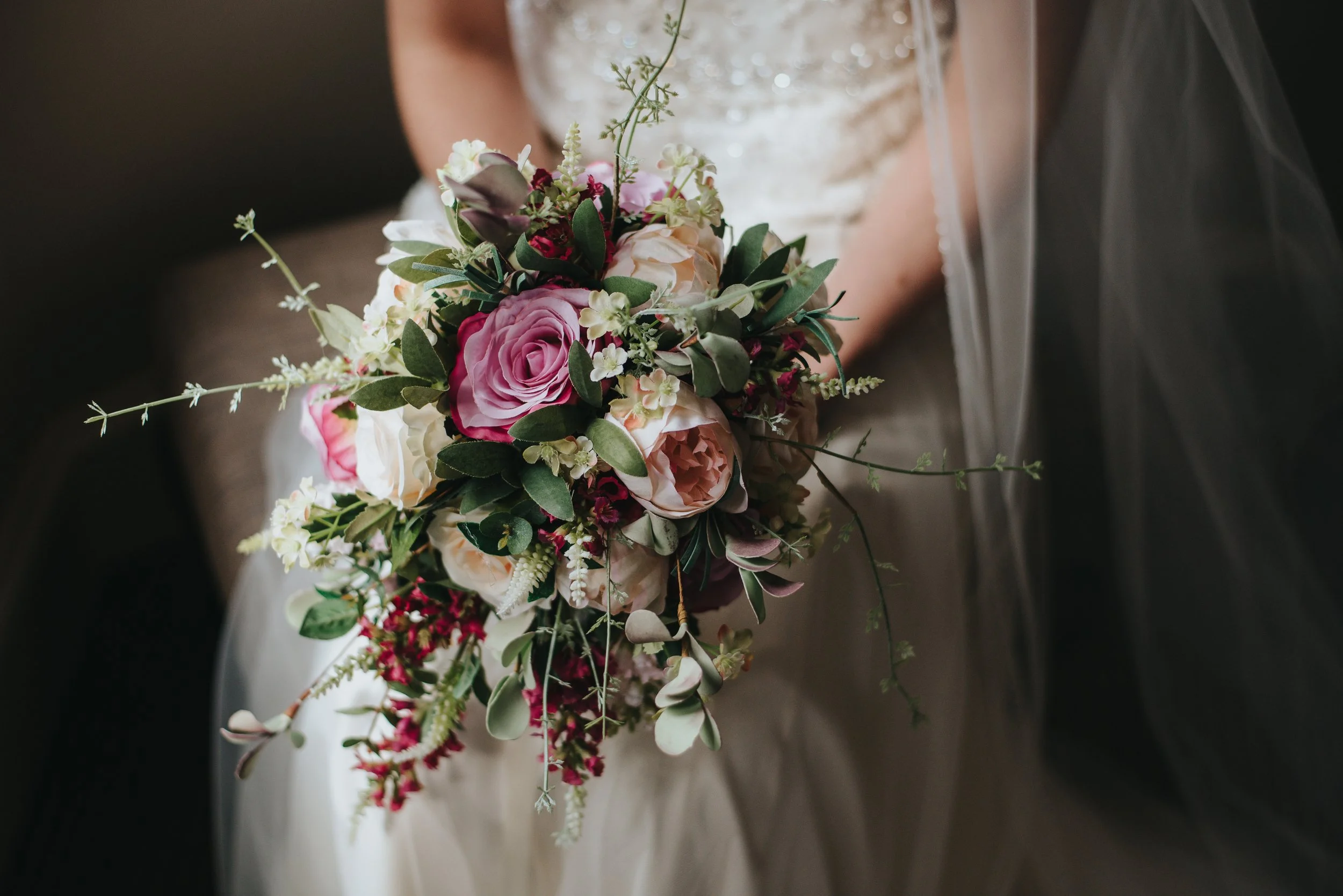 bride-holding-her-wedding-day-s-bouquet-beautiful-roses.jpg