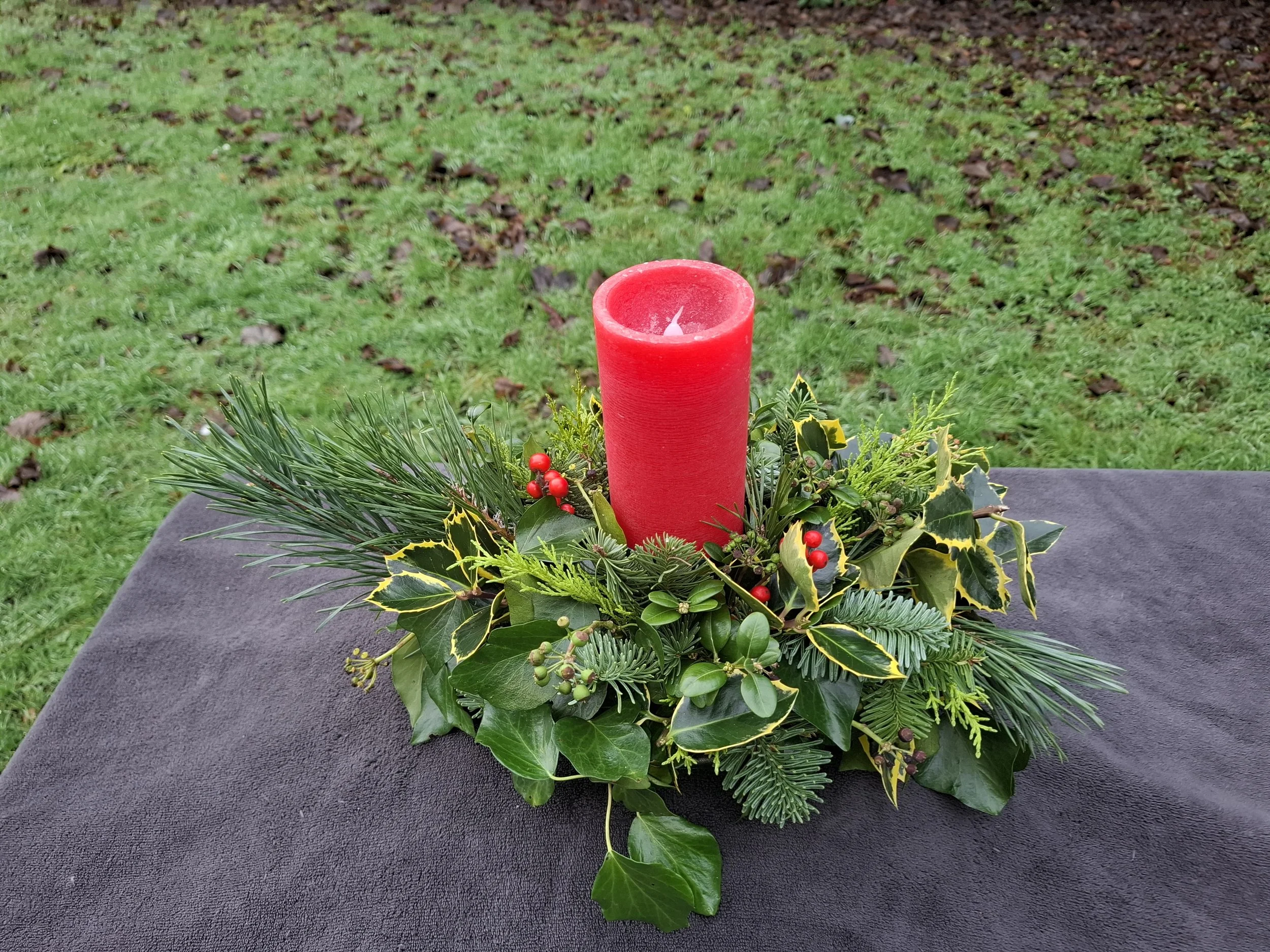1 Red LED Pillar candle holly and ivy arrangement_20251213_113812.jpg