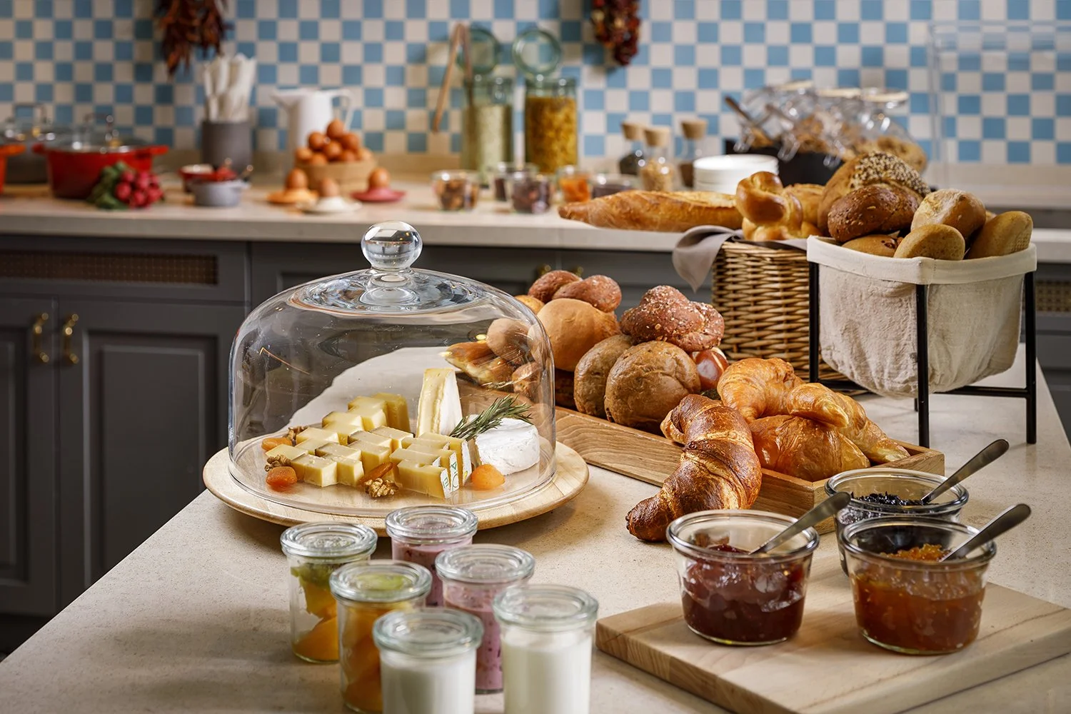Breakfast buffet with various pastries, fruit, 
jams, cheese and yoghur