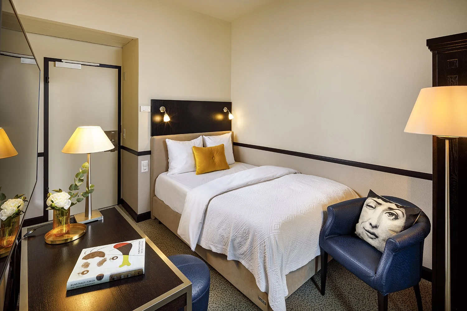 Modern, stylishly furnished small single  room with desk and seating area