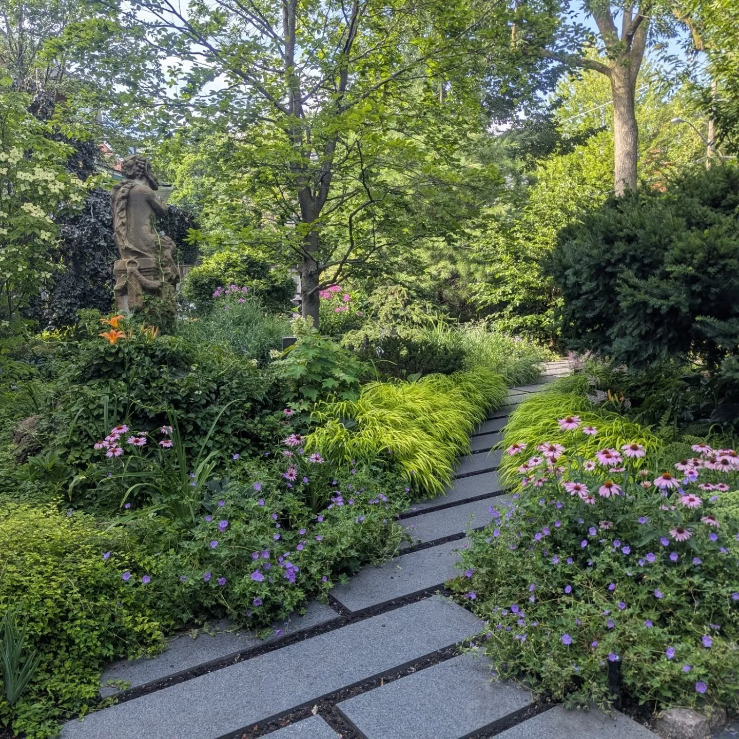 Hot days aren't so bad when you get to work in cool gardens like this one.

This out-of-the-box design by Ron Holbrook makes you feel like you're in an enchanted forest. 

It's becoming one of my favorites.