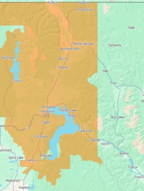 Map showing a region divided into orange and green areas with labeled towns and lakes, including Coolin, Cocolalla, Spirit Lake, Athol, Bayview, and Spirit Lake.