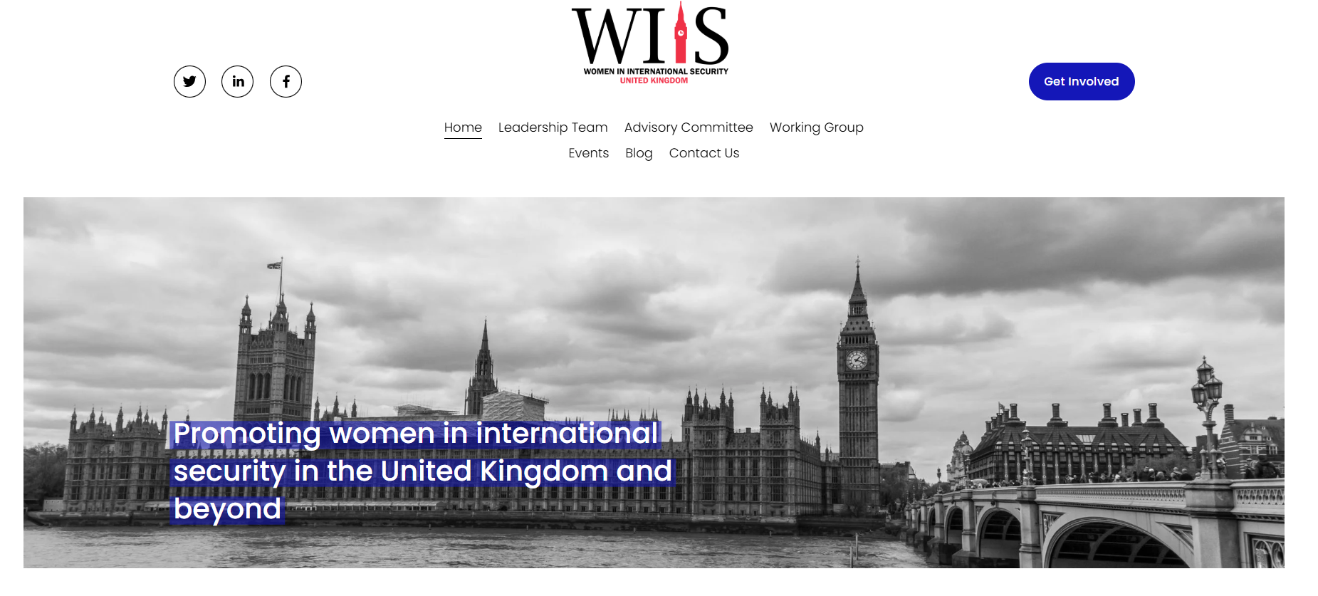 Black and white photo of the Houses of Parliament and Big Ben in London, England, with a cloudy sky in the background.
