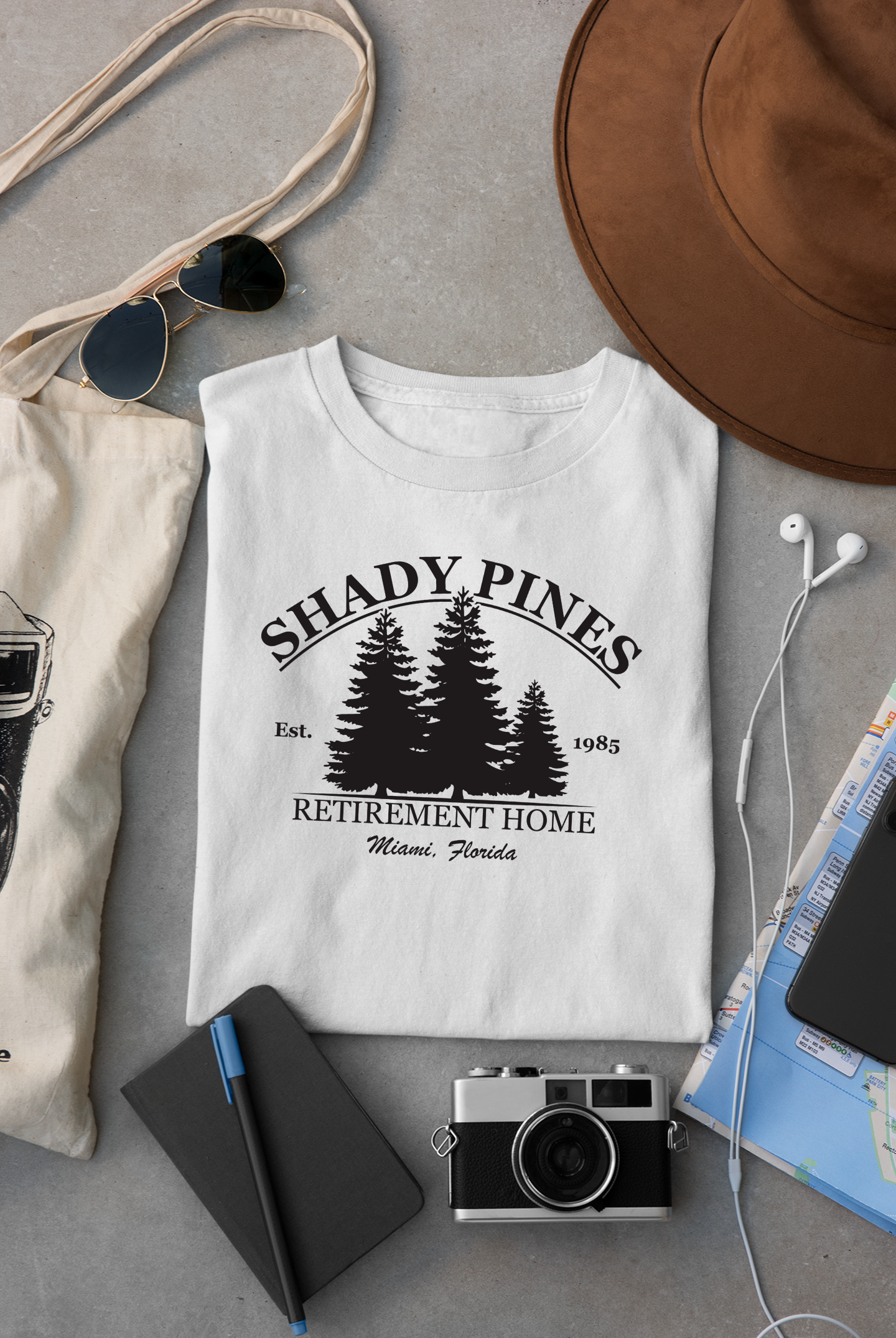 mockup-of-a-folded-t-shirt-placed-between-some-accessories-33794.png