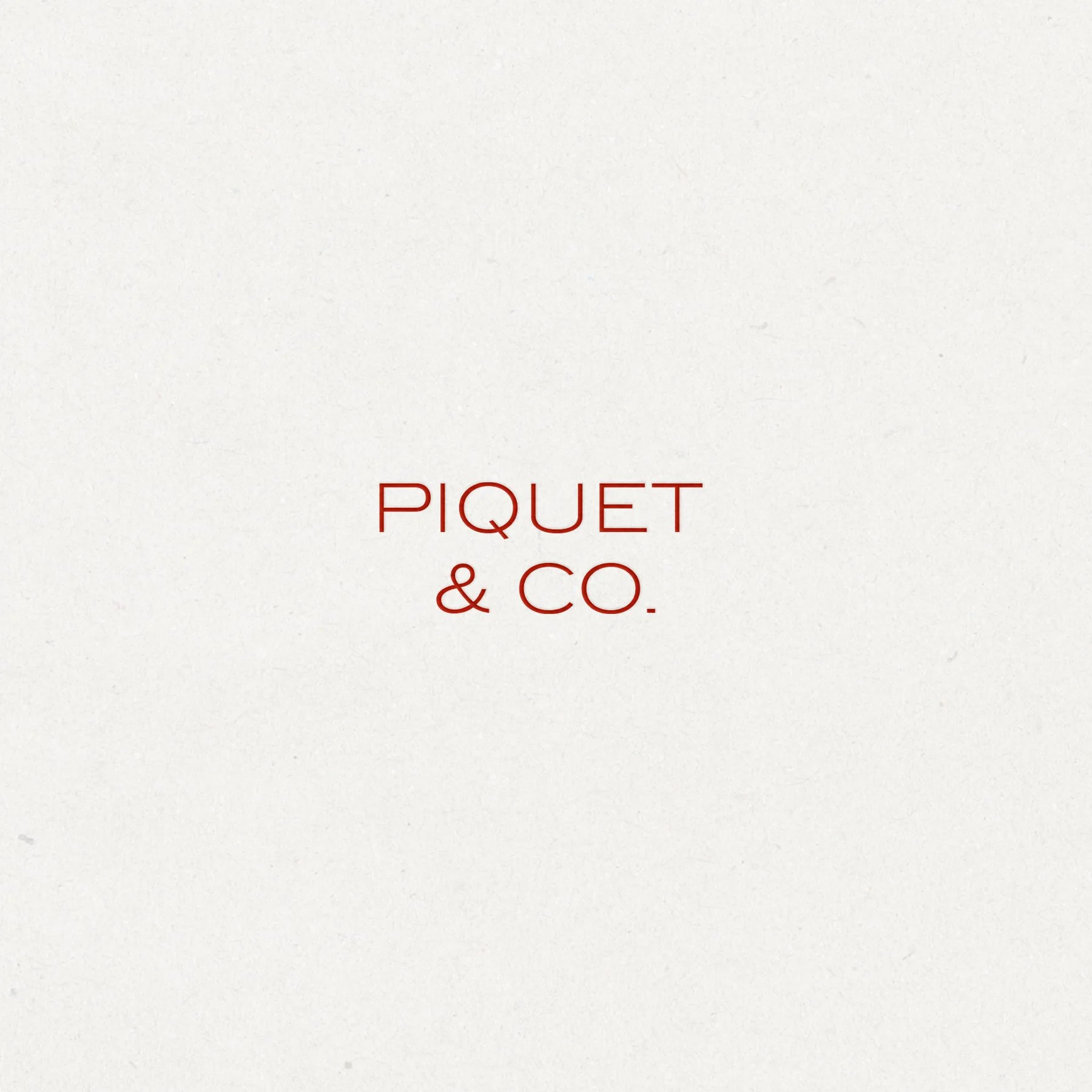 Piquet & Co. minimalist logo design in brick red on textured warm white paper