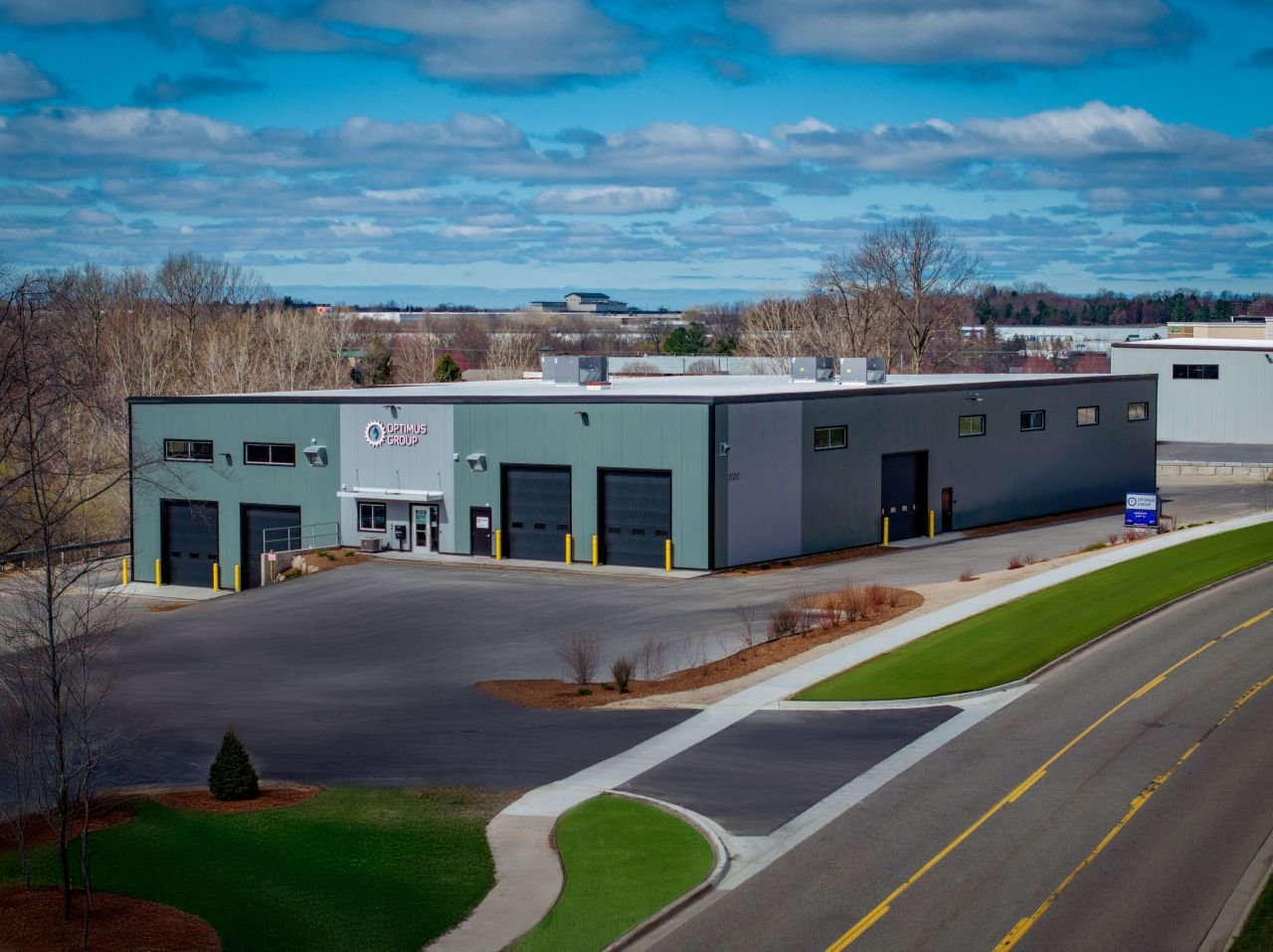 A drone picture of Optimus Group's building. Truck wash, trailer washout, diesel repair, propane autogas, fleet maintenance, Walker MI