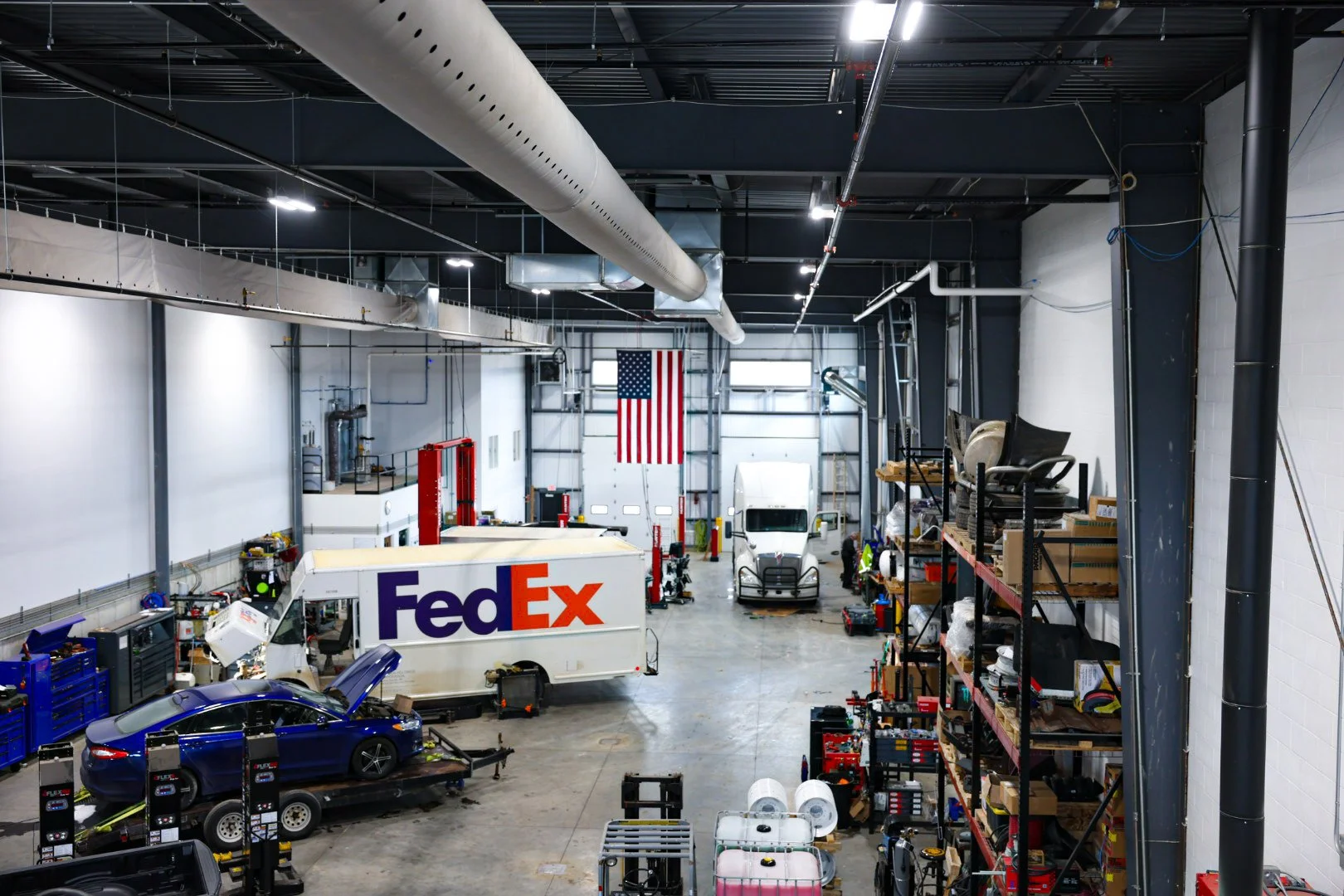 Optimus Group fleet vehicles parked at service location in Walker, MI — propane and truck maintenance provider.