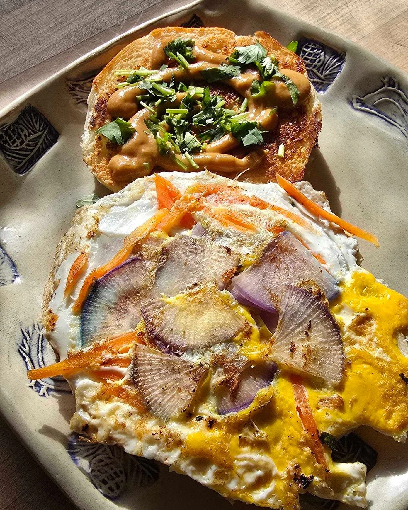 Can we talk about this weekend special for a second?

Pad Thai Breakfast Sandwich (V)
This one&rsquo;s doing the most in the best way.

Fried egg, creamy peanut sauce, shredded carrot, shaved radish, fresh cilantro, all tucked into a perfectly grille