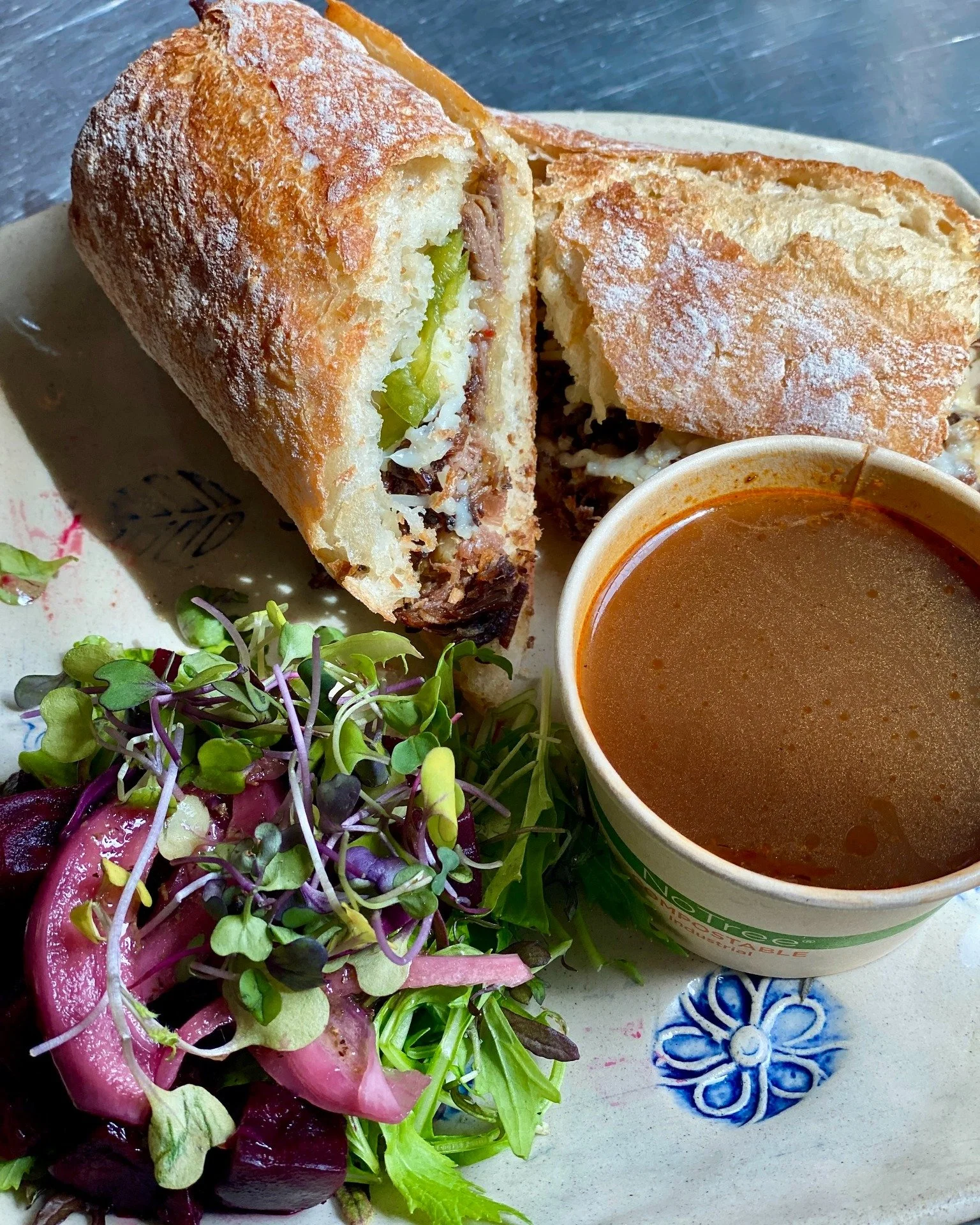 Staff fave for a reason! The Mexi Dip hits that just-right balance of subtle sweet heat... slow-braised beef brisket, melty pepper jack, candied jalape&ntilde;os, and caramelized onions on a grilled baguette, with rich braising jus for dipping.

Serv