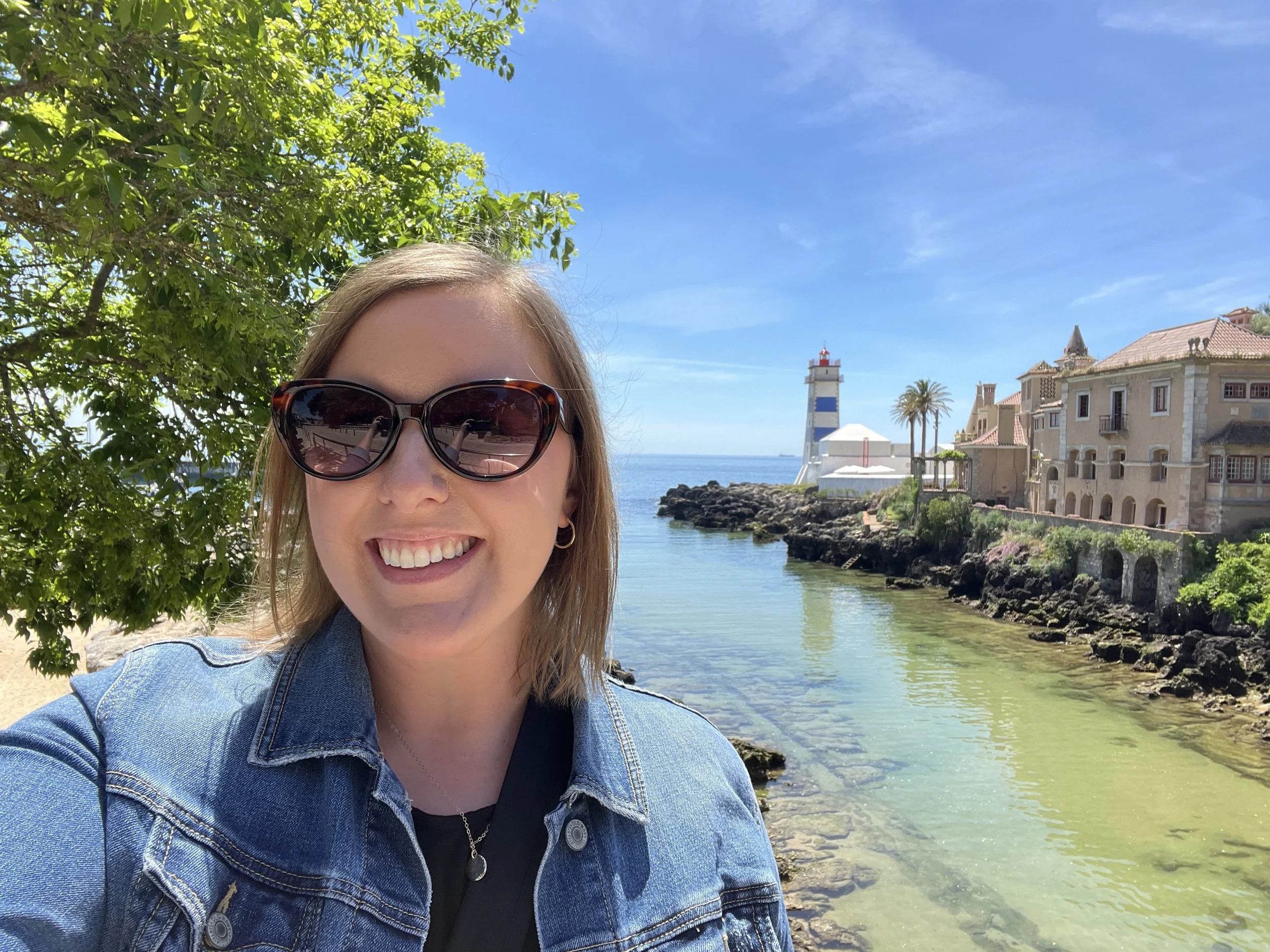 Katie Rockey in front of the Cascais Lighthouse in Cascais, Portugal