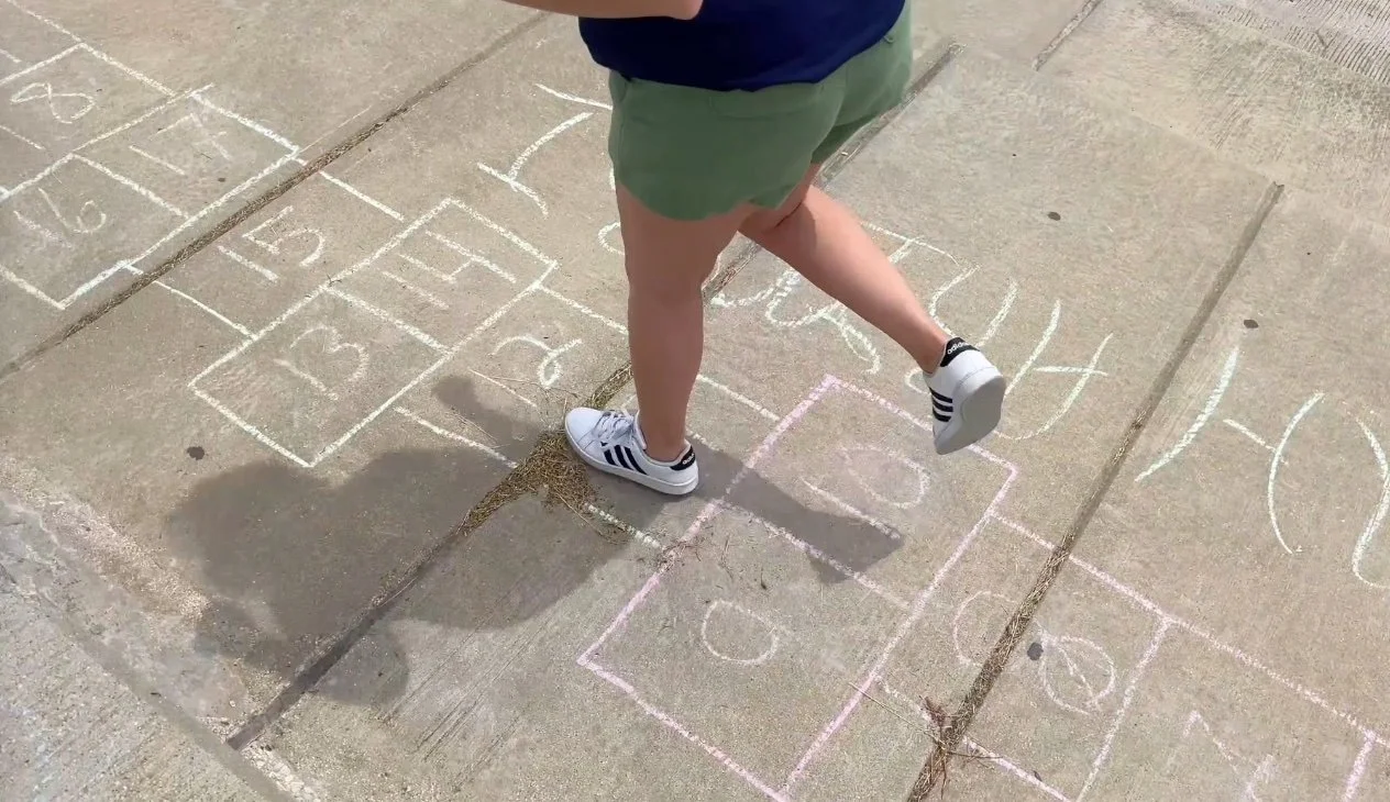 Playing hopscotch at North Avenue Beach in Chicago, Illinois