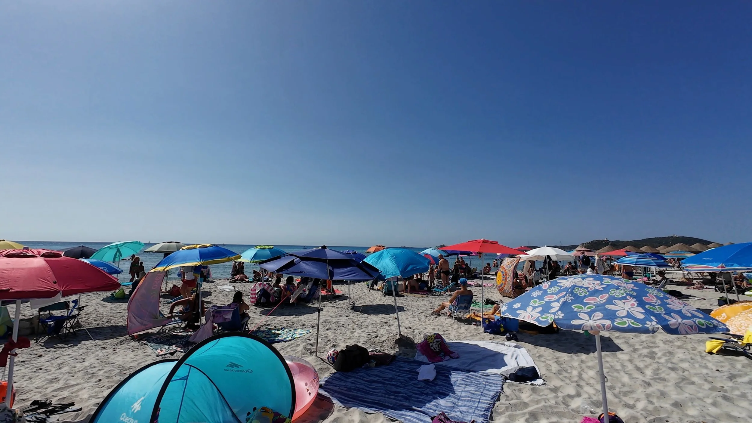 Umbrellas at Simius beach in Southern Sardinia