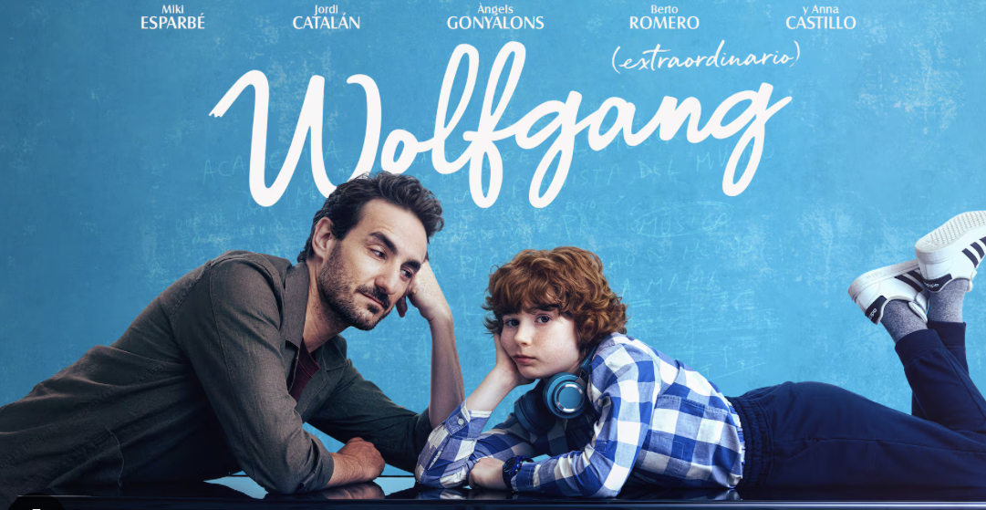 A man and a kid on a piano