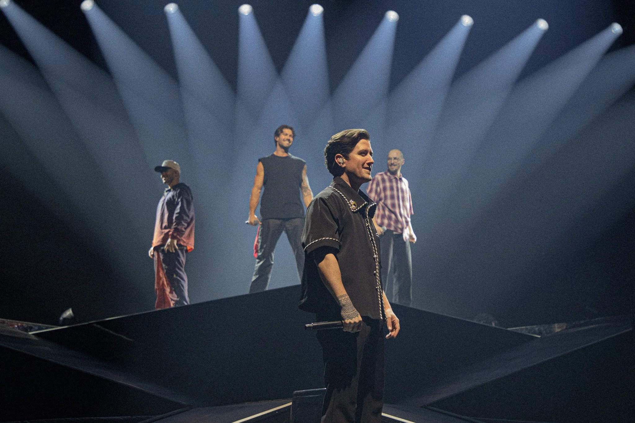 A boy band on stage.