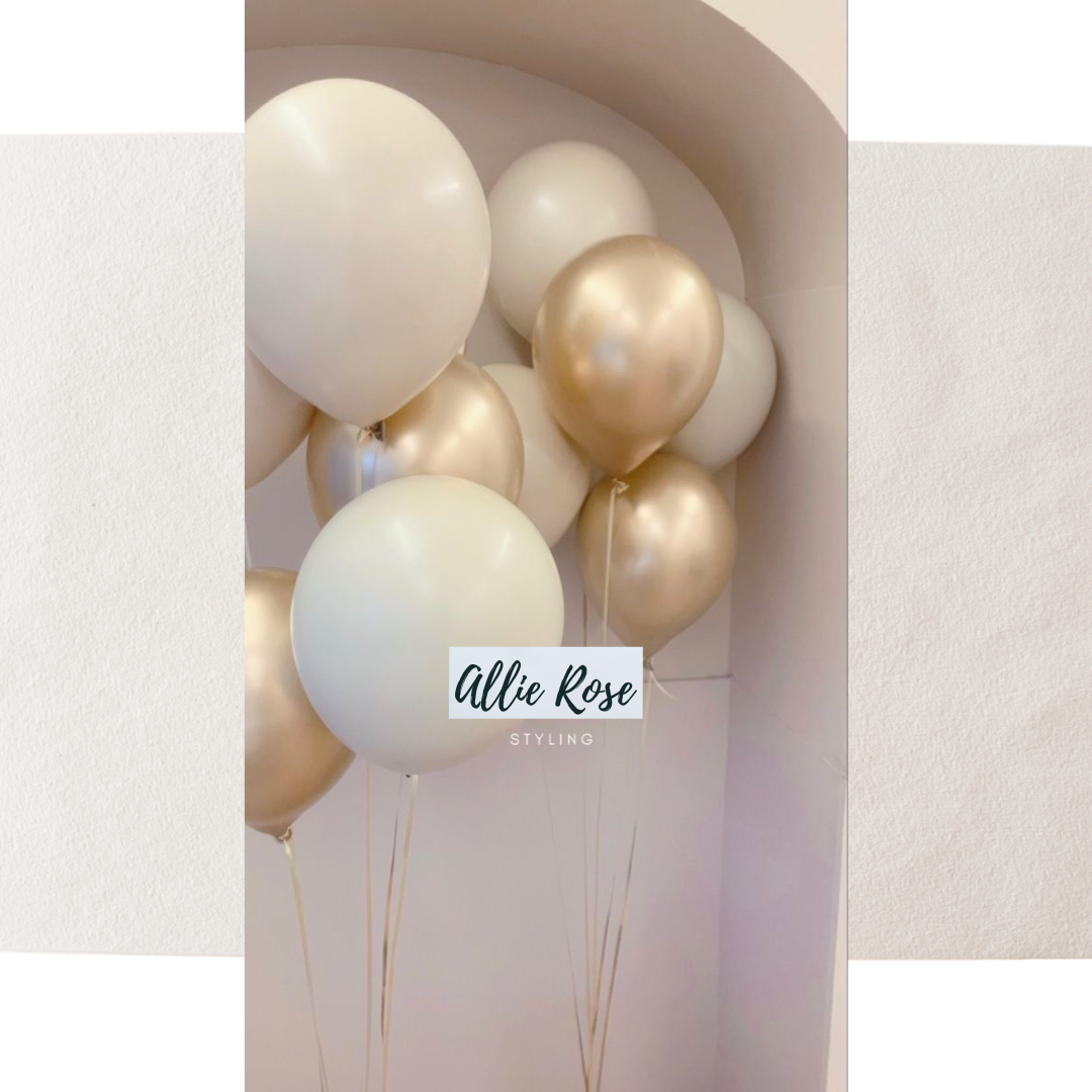 Cluster of white and gold helium balloons in a corner with a branding overlay for Allie Rose Styling