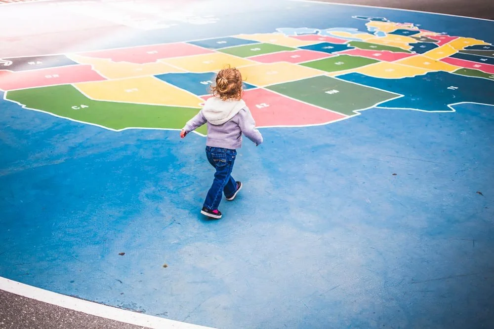 toddler on map showing california