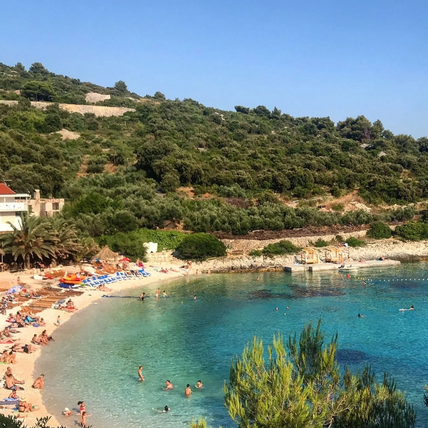 A scenic beach cove on Vis Island, Croatia, featuring clear turquoise waters and a peaceful Adriatic setting.