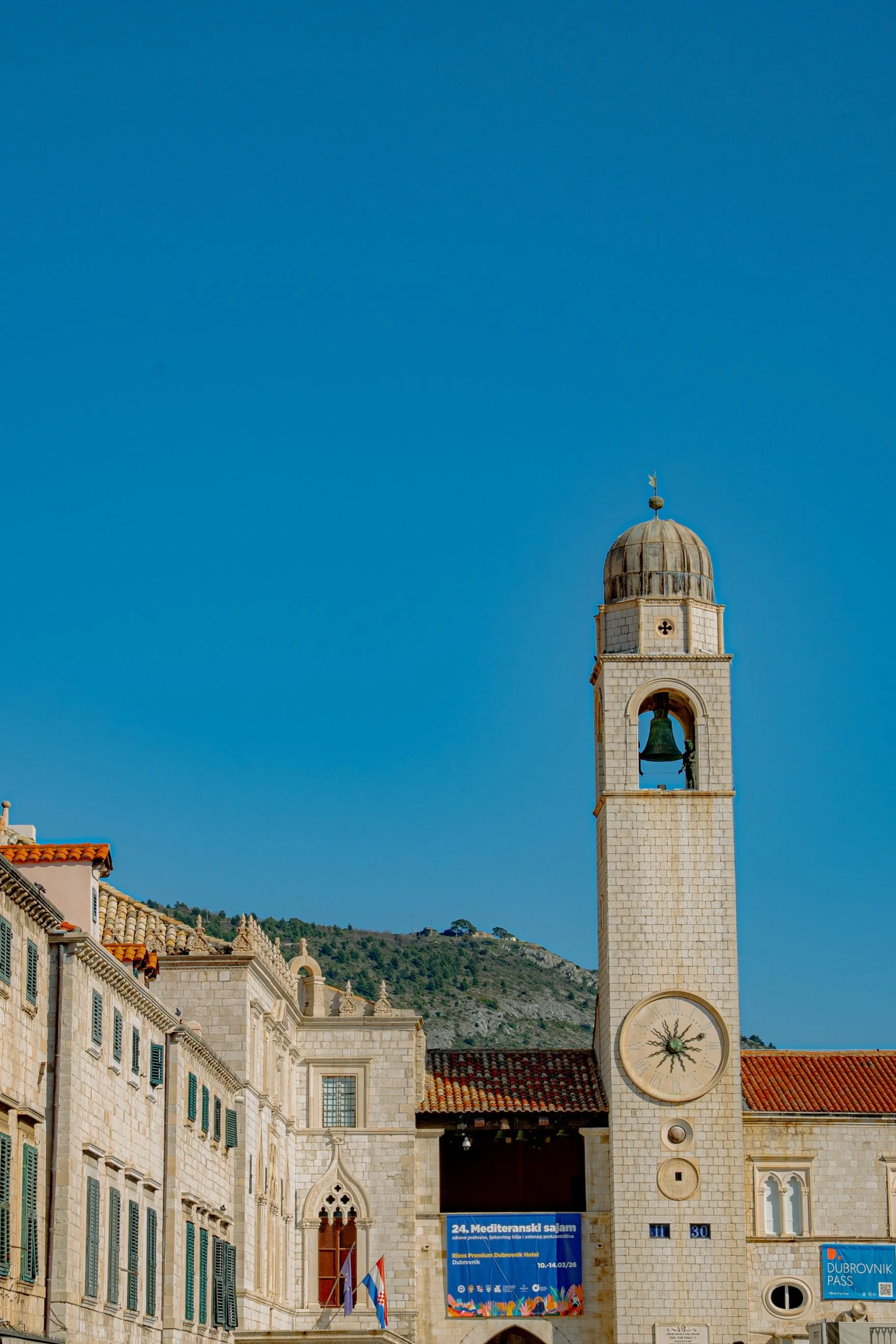 Stradun, Dubrovnik’s iconic main street in Croatia’s historic Old Town, leading toward the historic Dubrovnik Bell Tower.