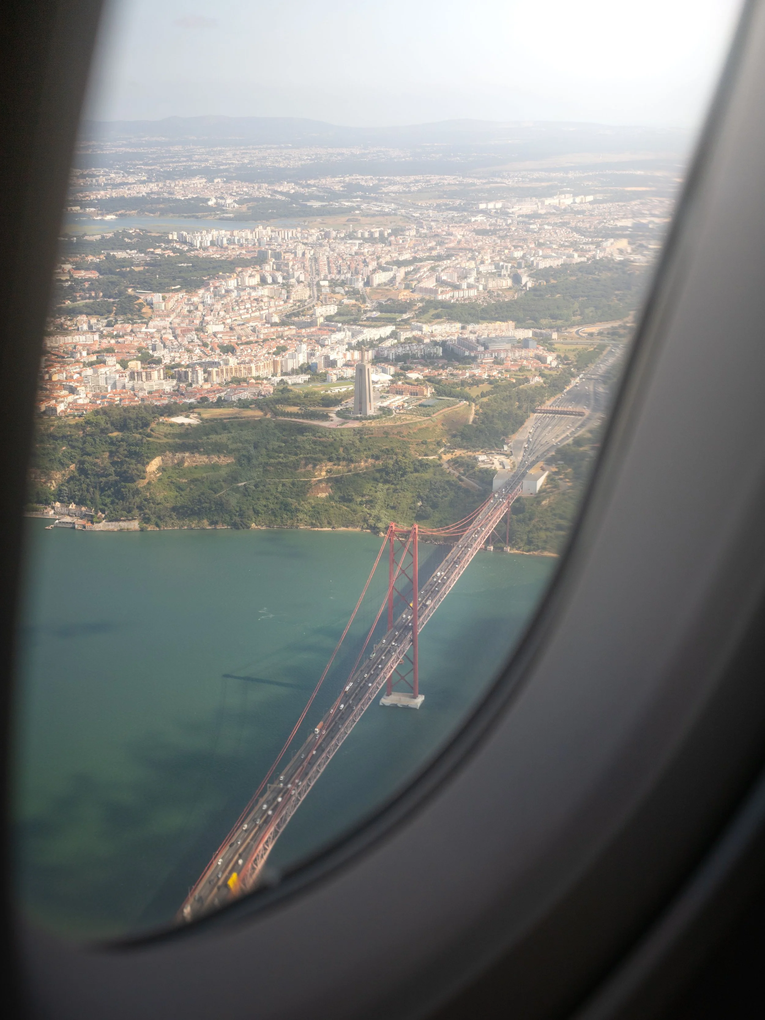 Aerial view of Lisbon and the 25 de Abril Bridge spanning the Tagus River, Portugal.