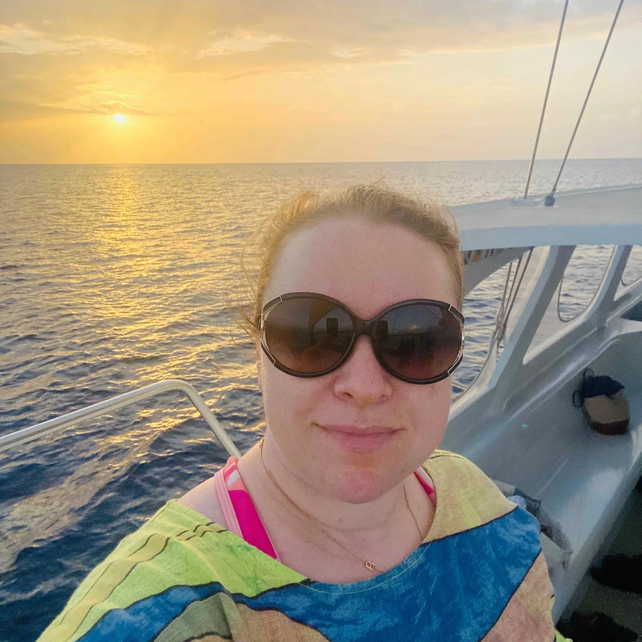 Catamaran cruise along the west coast of Barbados at sunset, with golden views over the Caribbean Sea.