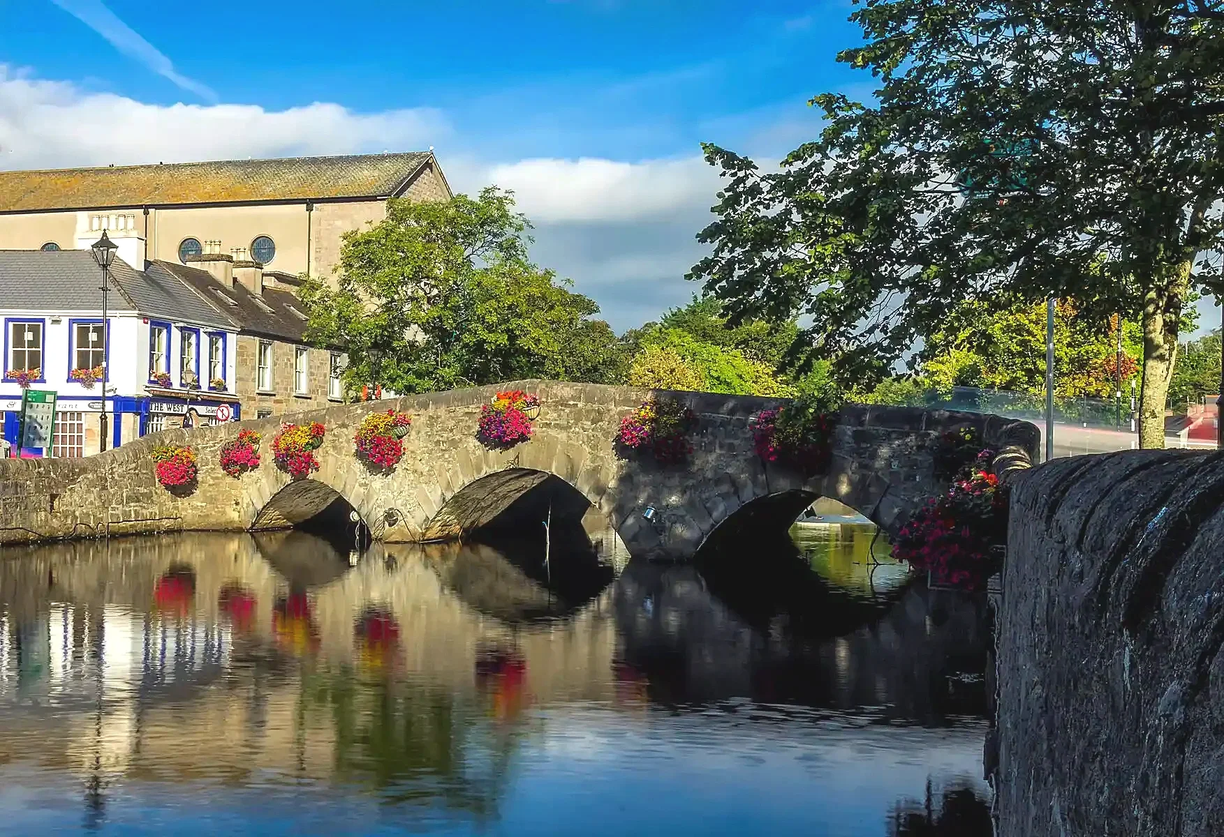 Westport, County Mayo, Ireland, a scenic coastal town surrounded by sacred mountains, stately homes, and island-studded bays.
