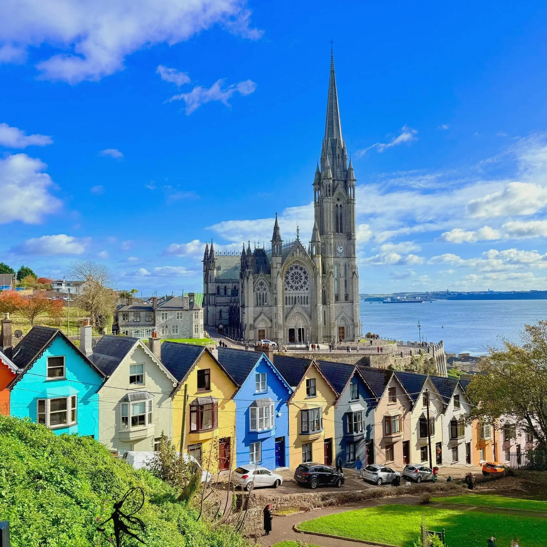 Cobh, County Cork, Ireland, a colorful harbor town overlooking Cork Harbour, known for its brightly painted hillside houses and striking St. Colman’s Cathedral.