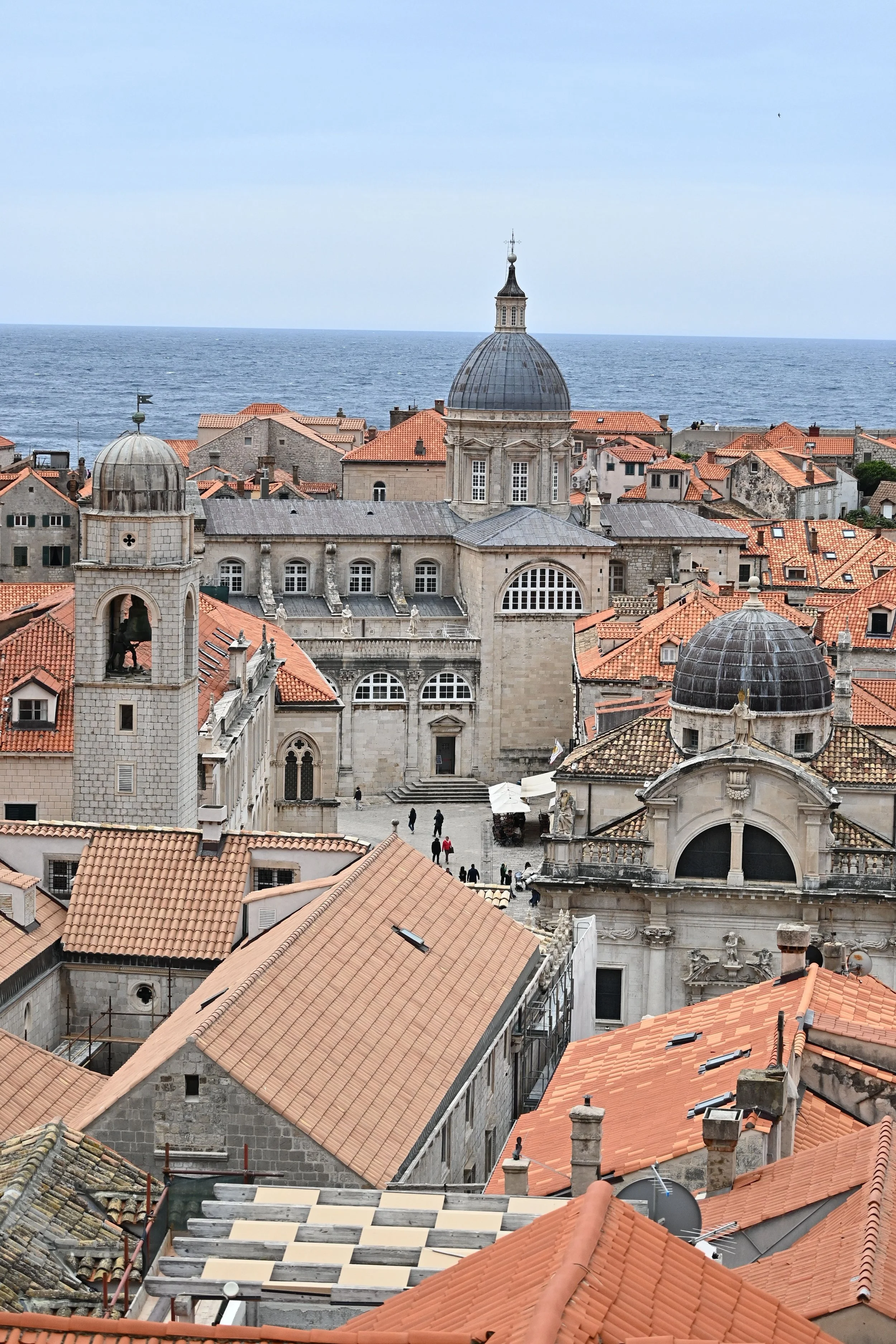 Dubrovnik, Croatia, featuring historic architecture, iconic red-tiled rooftops, and distinctive domed churches overlooking the Adriatic coast.