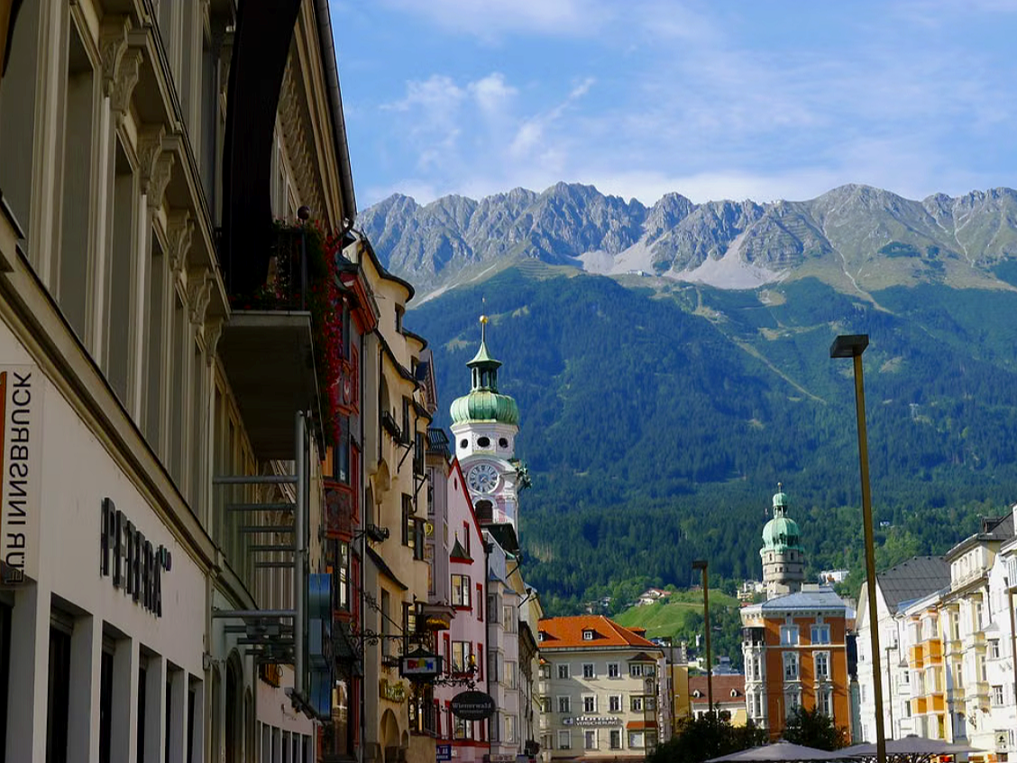 The Alps of northern Italy, offering scenic mountain views along the route toward Innsbruck, Austria, or Munich, Germany, for the flight home.