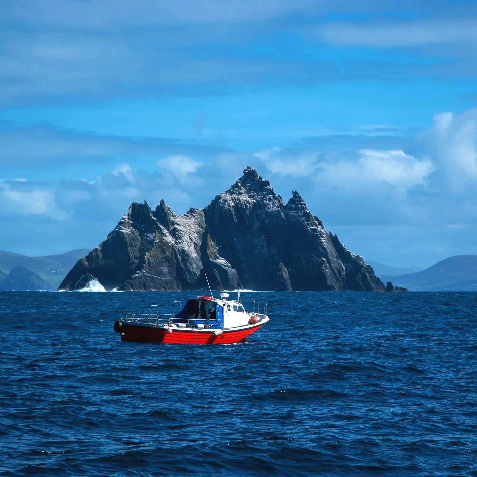 Skellig Michael off the coast of County Kerry, Ireland, a UNESCO World Heritage Site known for its dramatic rocky cliffs and remote Atlantic setting.