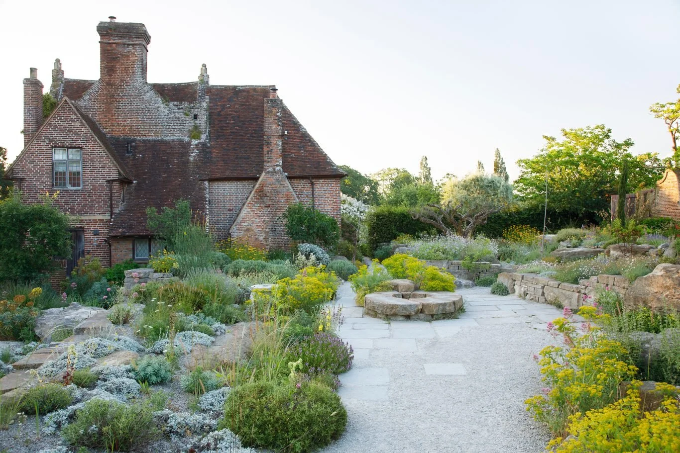 Delos Garden at Sissinghurst Castle Garden, featuring Mediterranean-inspired planting and stone terraces in Kent, England.
