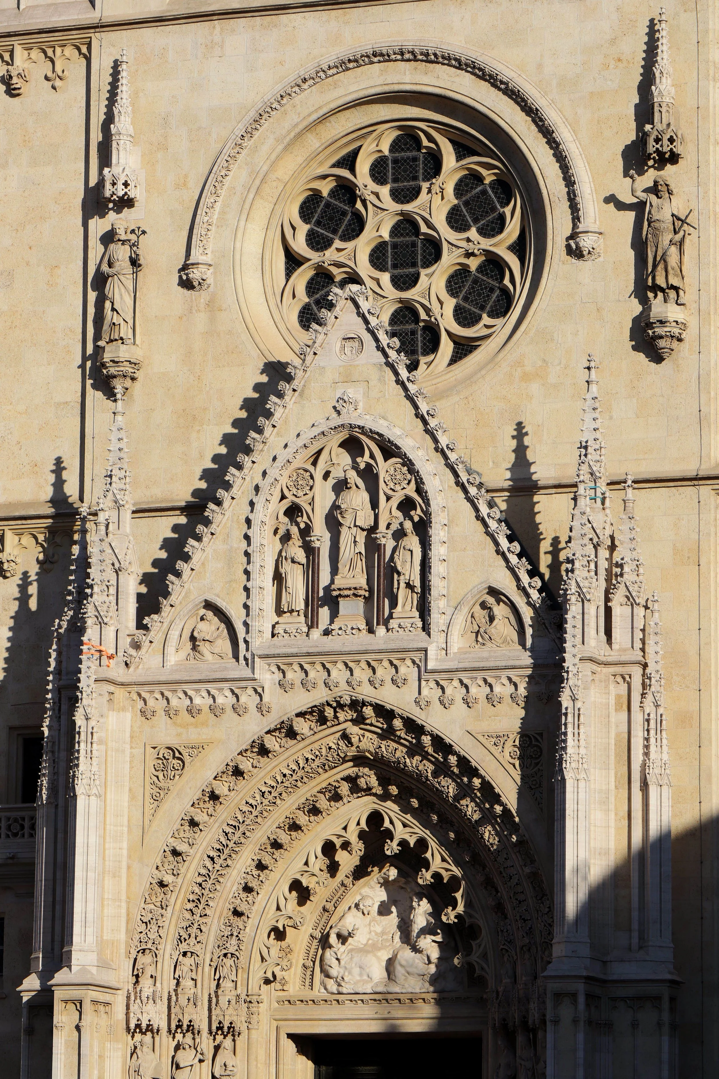 Zagreb Cathedral in Croatia, featuring a striking Gothic facade with intricate stone sculptures and a distinctive rose window.