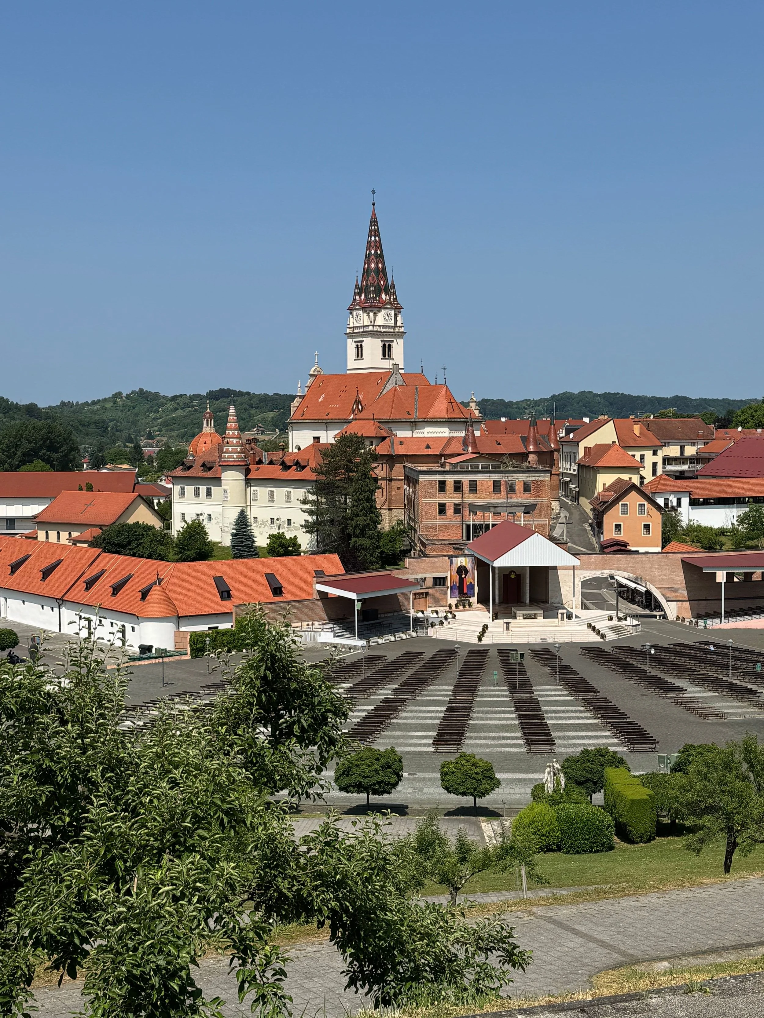 Croatian National Shrine of Our Lady of Marija Bistrica, a historic pilgrimage site with a distinctive church tower and red-tiled roofs in Marija Bistrica, Croatia.