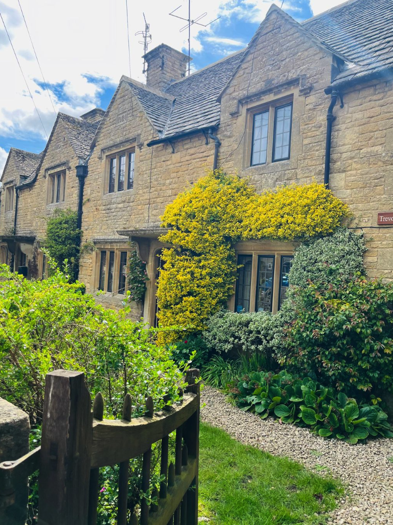 Trevone Bed & Breakfast, a traditional honey-colored Cotswold stone cottage in Bourton-on-the-Water, England.