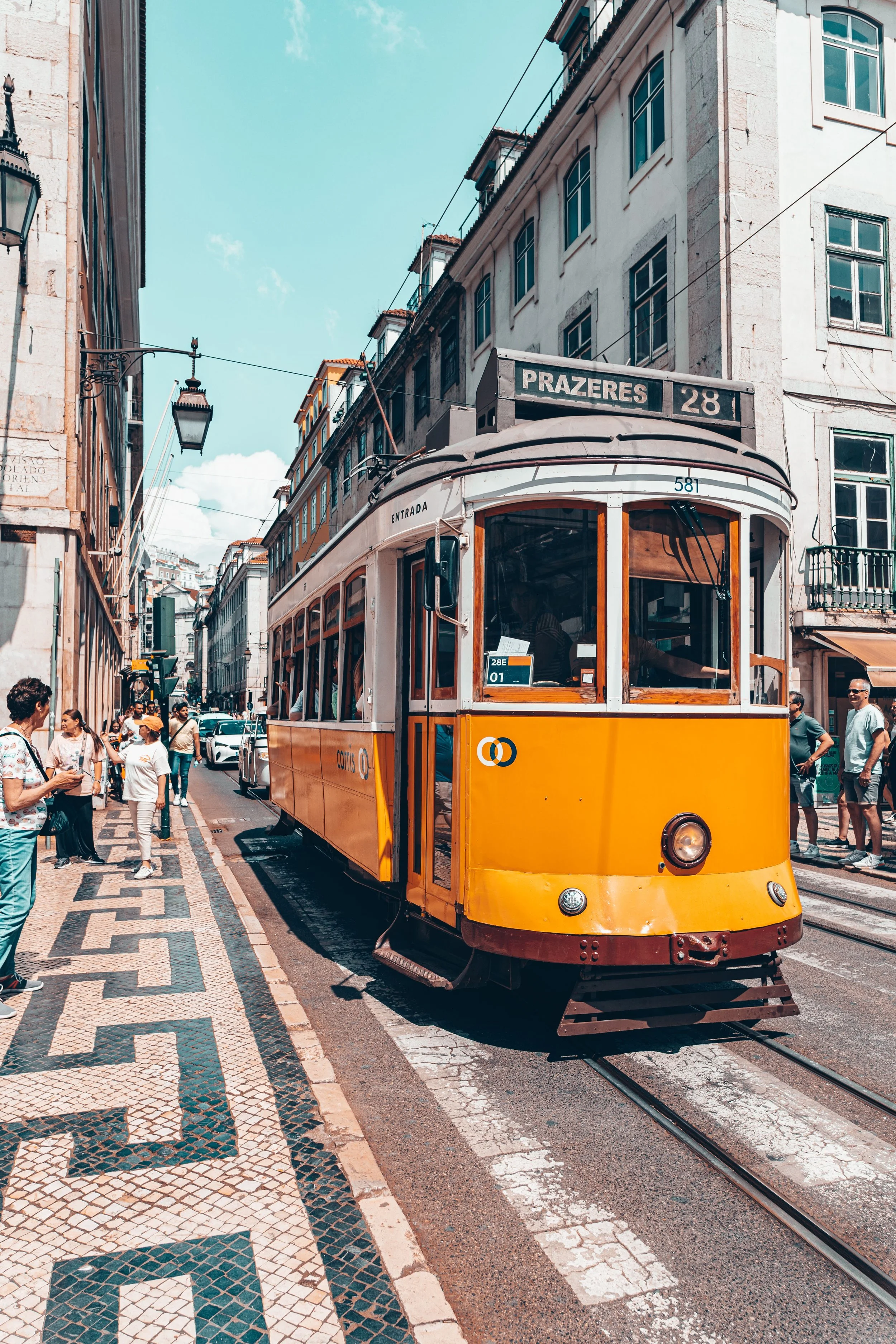 Tram 28 winding through Lisbon’s historic neighborhoods, Portugal.