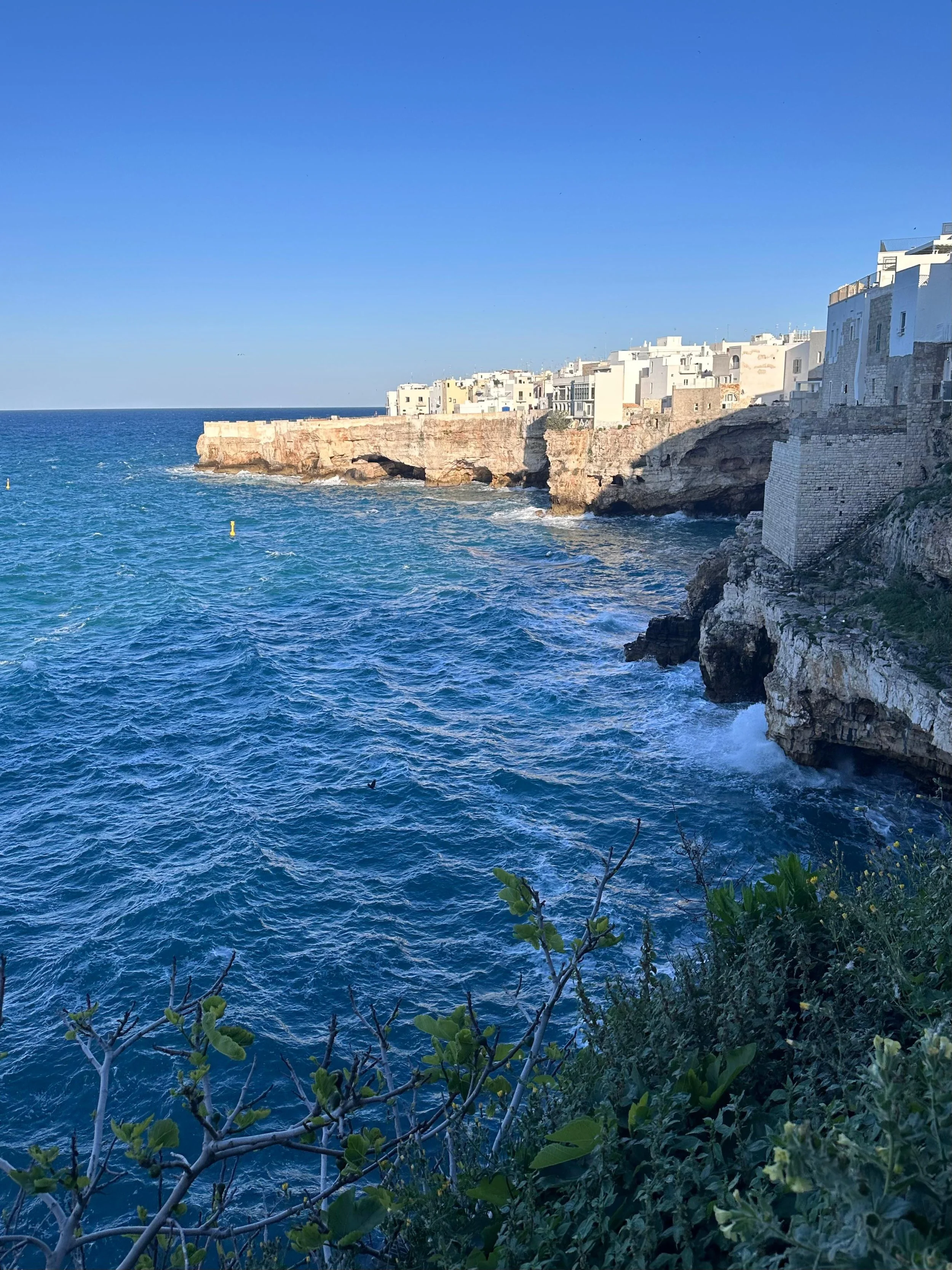 Polignano a Mare, a picturesque coastal town with limestone cliffs, whitewashed buildings, and the famous Lama Monachile cove in Puglia, Italy.