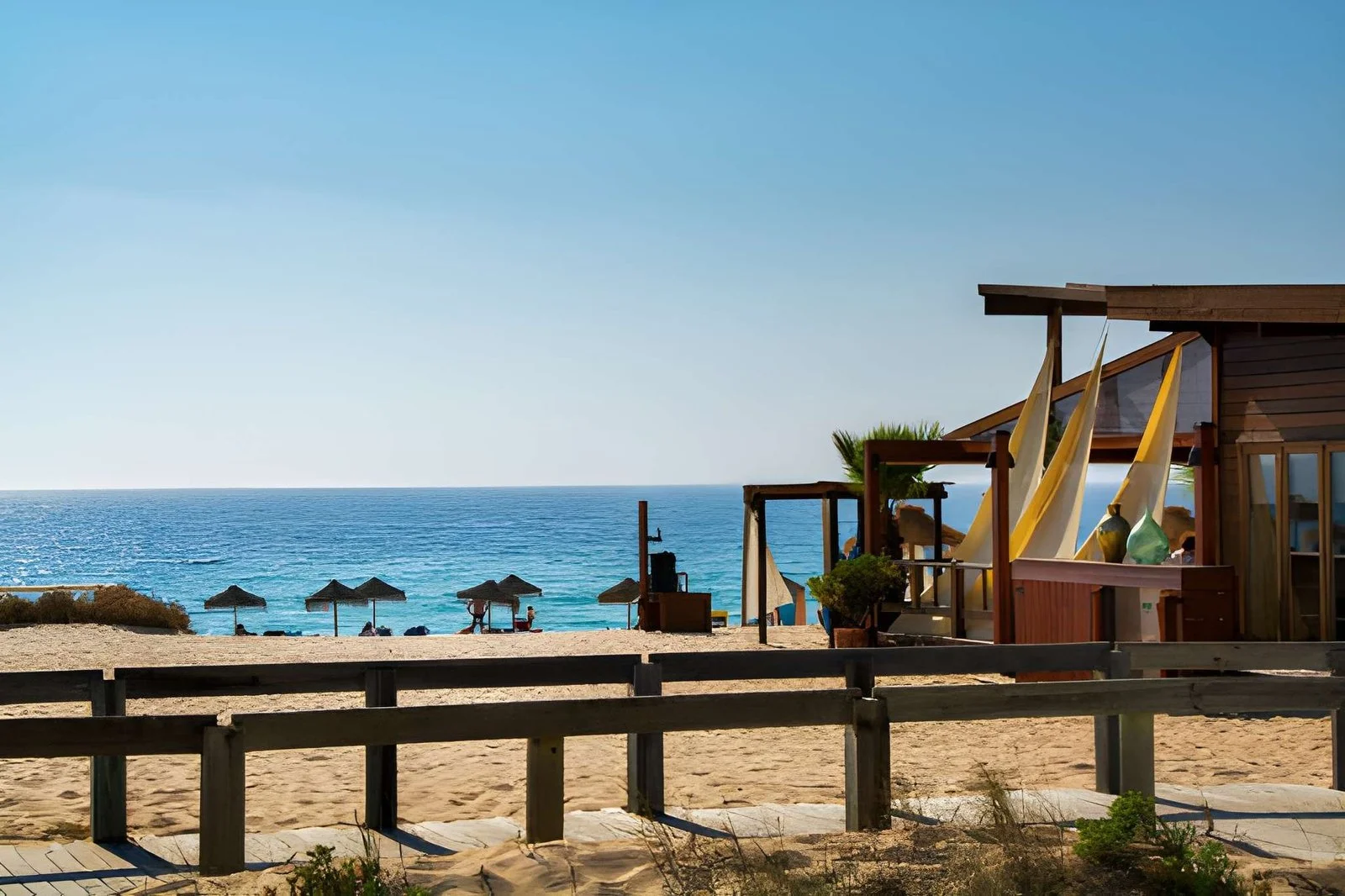Praia da Comporta, known for its sandy dunes and peaceful Atlantic coastline in Portugal’s Alentejo region.