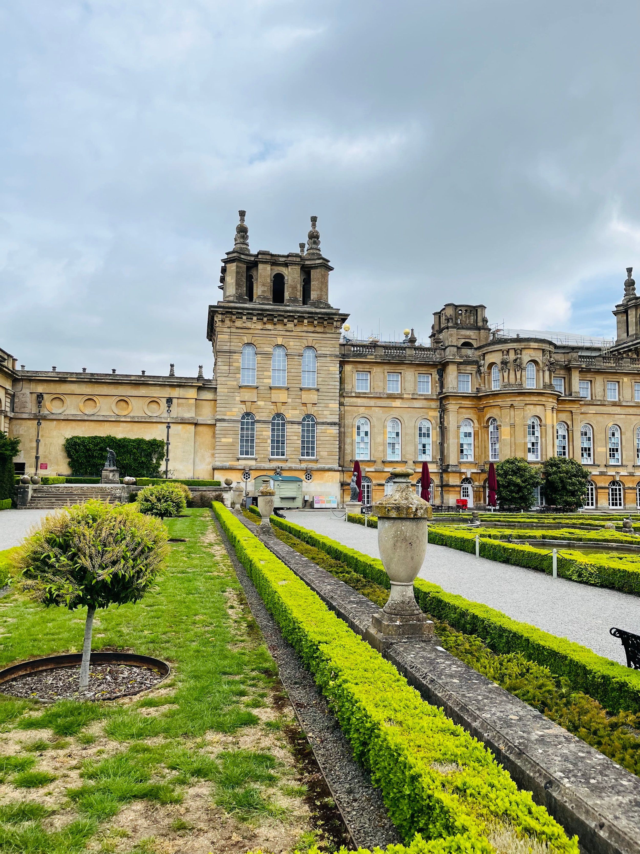 Blenheim Palace grand south facade with the Great Court and ornamental gardens, Oxfordshire, England