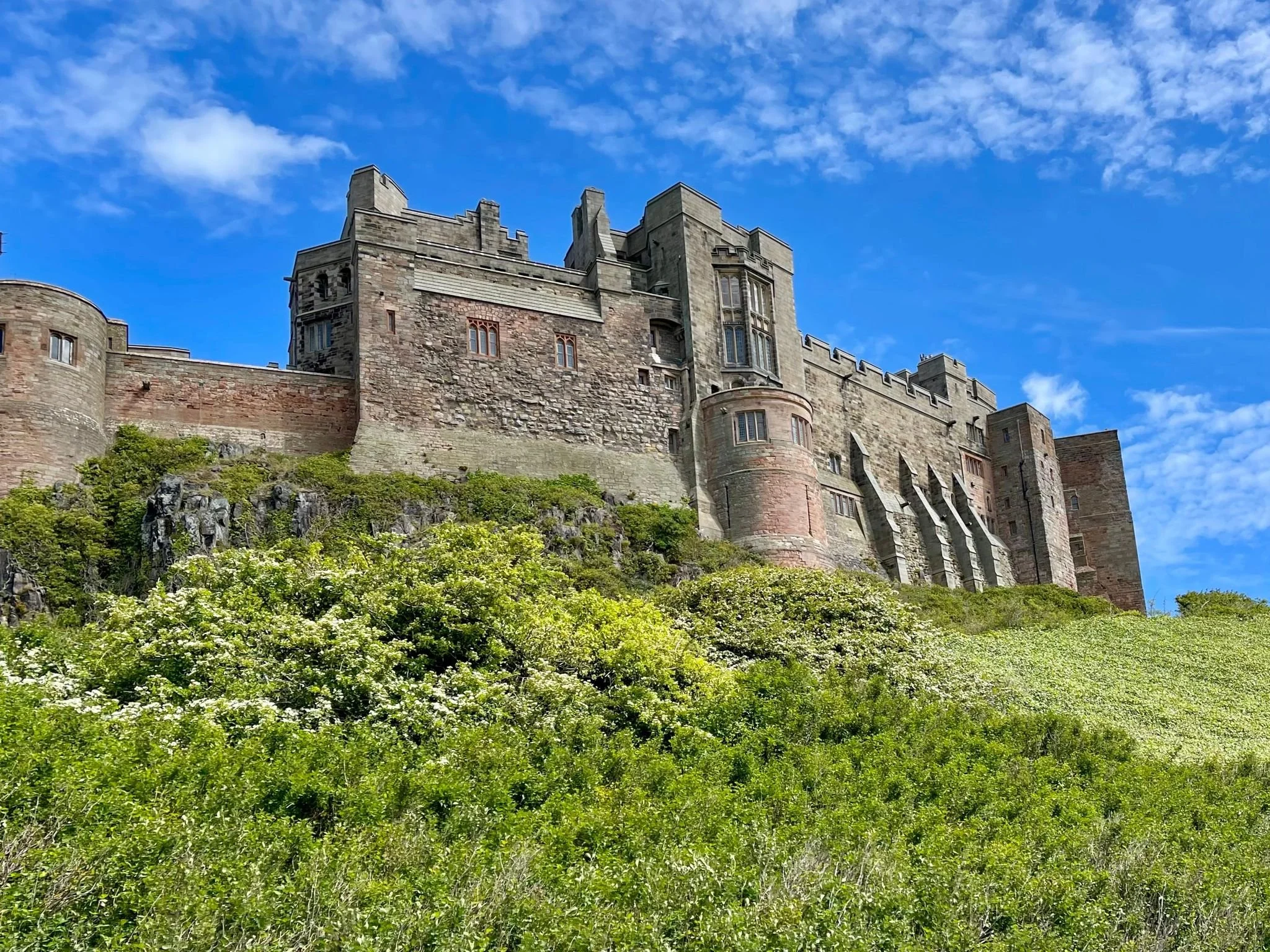 Bamburgh Castle, a historic coastal fortress overlooking the North Sea in Northumberland, England.