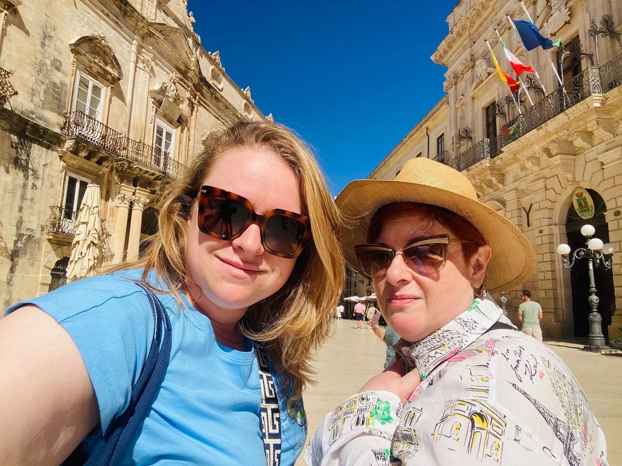 Piazza del Duomo on Ortigia Island in Syracuse, Sicily, Italy, featuring the historic square surrounded by elegant Baroque architecture.
