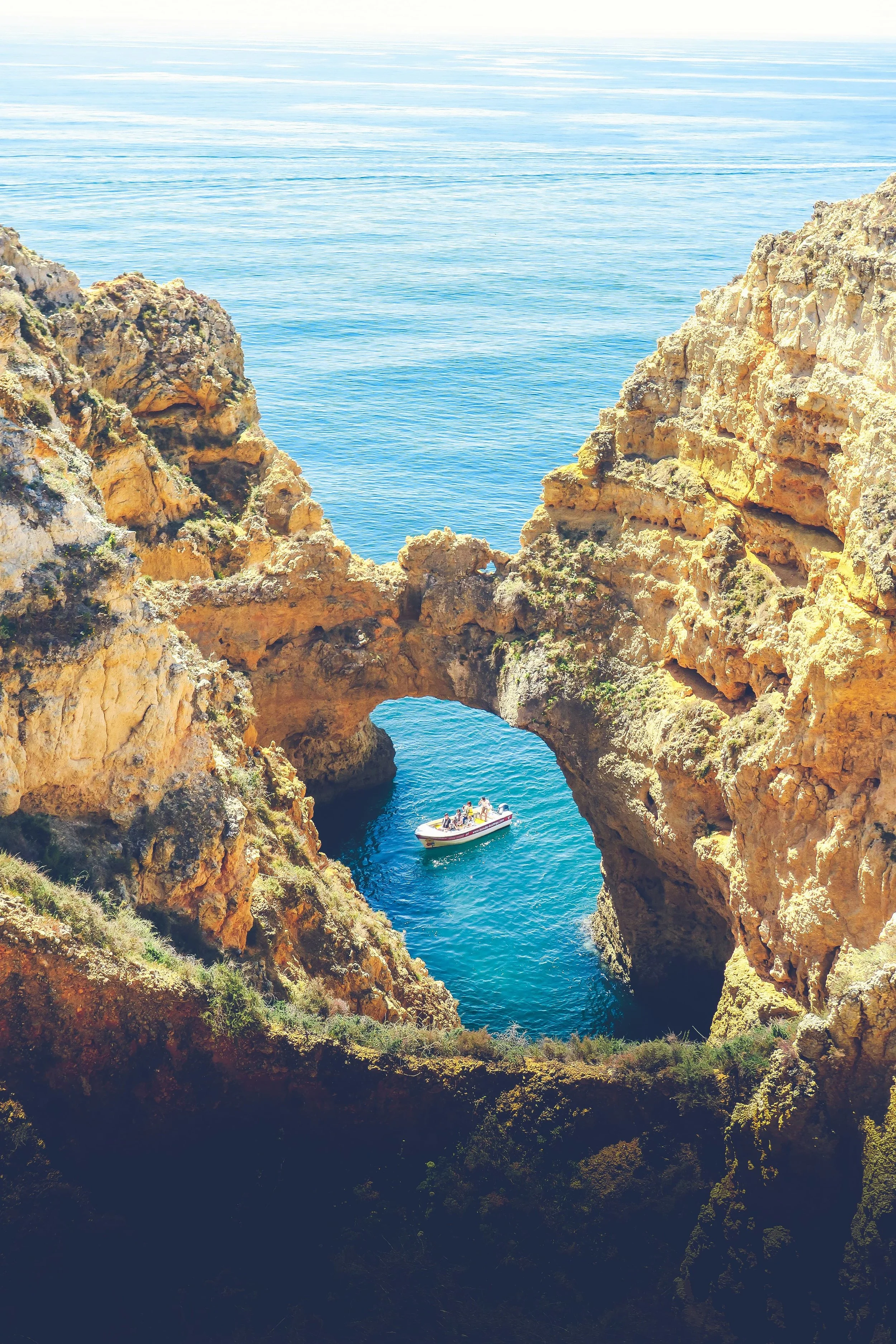 Ponta da Piedade, known for its golden cliffs, natural arches, and turquoise waters in Lagos, Portugal.