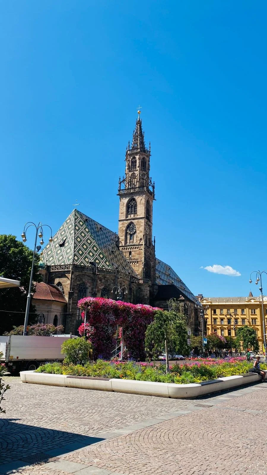 Bolzano Cathedral and Piazza Walther in Bolzano, South Tyrol, Italy, featuring historic architecture in a charming Alpine square.
